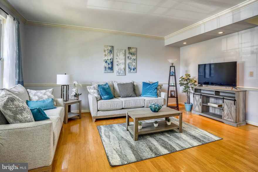 Beautiful End of Group Townhome with 3 Bedrooms and 3.5 Baths and lot's of updates.  Hardwood floors in living and dining room, crown molding, chair railing and spacious eat-in kitchen with dining area, plus breakfast bar, stainless steel appliances, recessed lights and tile backsplash.  Sunroom bump-out with tile floors and sliding door that leads you to a spacious deck so you can enjoy all your summer gatherings.  Main level half bath and Upper level features owners suite with vaulted ceilings, walk-in closet, ceiling fan, double sided gas fireplace and an amazing spa like bathroom - perfect for relaxing - two additional large bedrooms and full hallway bath completes the top floor.  The lower level features a family room with tile floors, crown molding, bar with mini-fridge - perfect for entertaining, large storage area, full bathroom  open your sliding door that takes you to your private patio with lots of existing trees.  Welcome to your new home!