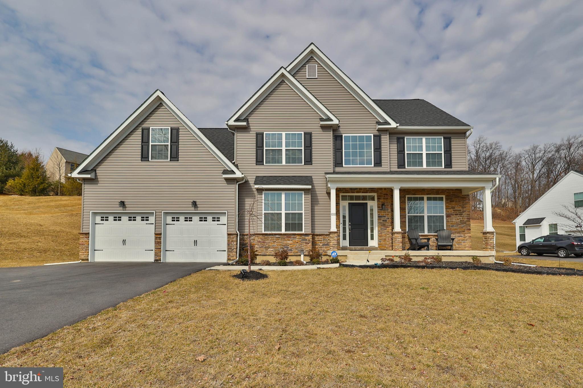Welcome to 8393 Scenic View Drive, in the beautiful Valley West Estates neighborhood of Upper Macungie Twp, PA. This wonderful under-2-year-old home is part of the highly rated Parkland school district. You are greeted with a large open foyer as you enter the house. On the left is an Office/Library with glass French doors for privacy, and to the right, a Formal Living Room and Dining Room featuring a coffered ceiling. To the back side of the home, you will find a white kitchen featuring a large island, granite counters, and stainless-steel appliances. Just off the kitchen is a spacious family room with a gas fireplace, cathedral ceiling, and recessed lighting. A sliding door off the kitchen lets you walk out on your maintenance-free Trex deck. The main level also features a large laundry area, a half bath, and walk-out access to the two-car garage. Just up the stairs is the primary suite with his and her walk-in closets, a bonus room, three additional generous-sized bedrooms, and a full bath. The unfinished basement, created on a state-of-the-art foundation, is a blank canvas. Egress access and a bathroom rough-in allow for a future bed/bath and additional living space.