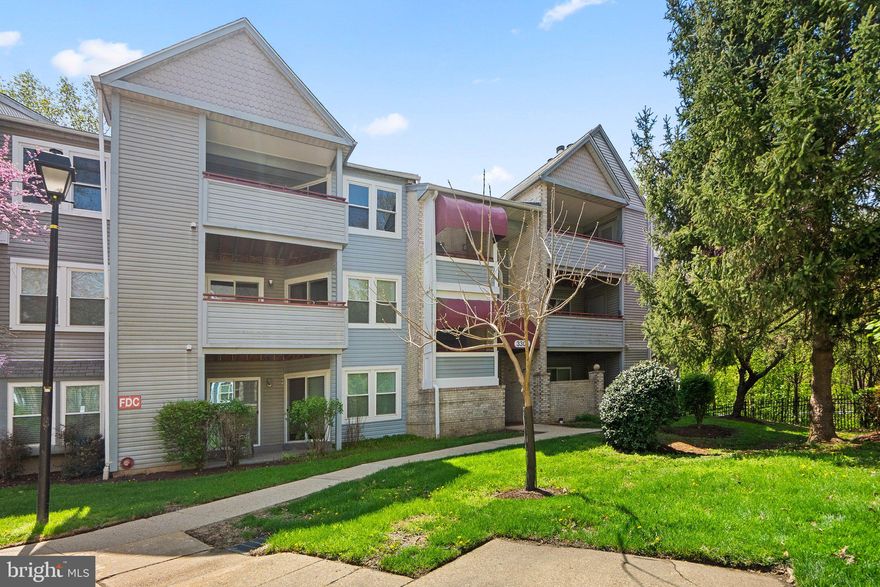 The community is Not FHA Approved, MUST BE CASH OR CONVENTIONAL FINANCING WITH AT LEAST 10% DOWN and work with an experienced lender. This spacious 2-bedroom, 2-bath top floor condo unit offers comfort and charm in a convenient Silver Spring location. The living room features a cozy fireplace, vaulted ceiling and built-in shelving making it a great area to gather with family & friends. From here, step out to your private balcony, also accessible from the second bedroom — ideal for morning coffee or evening relaxation.
The galley kitchen flows into a dedicated dining area with stylish pendant lighting. The primary suite boasts a large walk-in closet and an en-suite bath with double sinks. The second bedroom includes its own closet and easy access to the hall bath, making it perfect for guests or a home office.