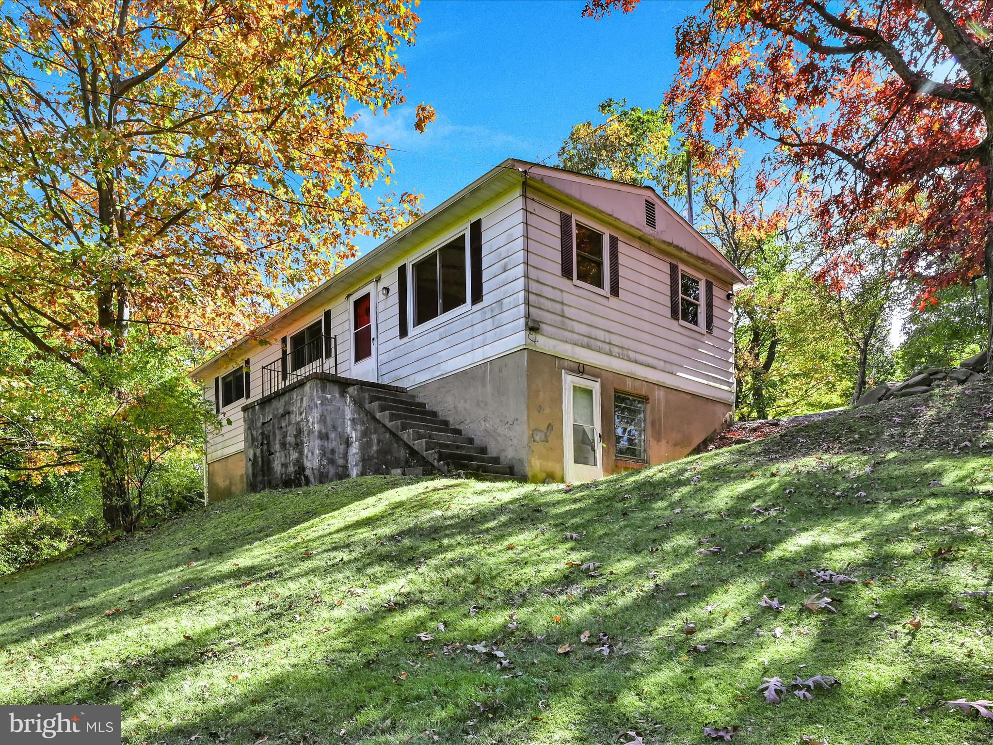 Country living near town with easy one-floor living and recent updates. Large living room with vaulted ceiling and beautiful beams makes it a great place for entertaining. Kitchen is compact yet functional with new cabinets and countertop and is conveniently located next to the formal dining room. Formal dining room has space to add more cabinets and counterspace if needed. There are 2 bedrooms with one currently being used for laundry. New roof installed in 2021. Newer water heater and mostly new plumbing. New flooring in living room and dining room. Home could use some cosmetic updating but has solid bones. Schedule a showing to see how you could make this place your own!