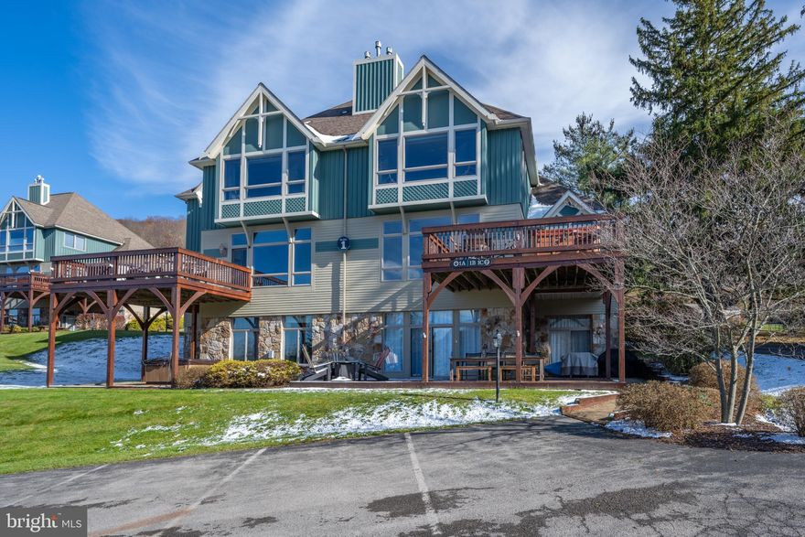 This magnificent  fully renovated 2,400 sq ft Condo has been thoughtfully updated, boasting a contemporary kitchen w/ built in ice maker producing 50 lbs per day, upgraded bathrooms, Luxury Vinyl Plank flooring, a state-of-the-art HVAC system, and fixtures that elevate your living experience. Sound-dampening insulation has been added, ensuring tranquility and peace.

Indulge in luxury living, with custom finishes found throughout, creating an ambiance of sophistication and elegance.

Savor the mesmerizing vistas of Deep Creek Lake and the Wisp Resort Ski Slopes. With four master suites, this residence offers the ultimate in comfort and privacy for all.

Positioned perfectly for the July 4th "Fire on the Mountain" fireworks display, you can revel in the grandeur of this annual event. The convenience of one-level living, free from steps, allows for ease and accessibility.

Relax in the hot tub, perched high above Deep Creek Lake and the Wisp Ski Slopes, where you can unwind while taking in the stunning surroundings. With turn-key ownership and complete furnishings, this property is ready for you to call home.  Sellers 24' Four Winn Boat available on a separate purchase. 

Ample parking adds to the convenience of this exceptional residence, ensuring that every aspect of your living experience is designed for comfort and ease.  Call today for your private showing