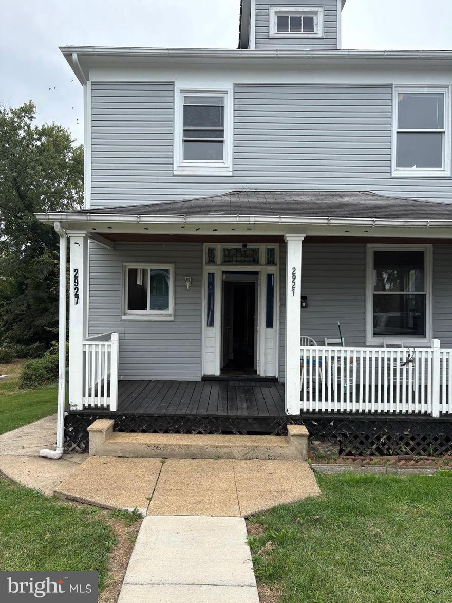 Welcome home to 2927 Woodland Ave! This charming, detached home is move-in ready with very minor appliance additions. There are two distinct sections to the home, which means one can live in one section and rent the other.  There are two HVAC units, two water heaters and two electric panels. Relax on the spacious front porch before stepping inside to a bright and inviting main level which features new laminate floors, large living room with a fireplace, kitchen, two bedrooms and a full bath. Upstairs you'll find three comfortable bedrooms with plush carpet, along with a kitchen and full bathroom. The lower level provides flexibility for storage or future expansion, with the potential to create income-producing space, thanks to its own entrance. Outside, enjoy an expansive yard with endless possibilities—including off-street parking for several cars. The outside space is perfect for gardening, entertaining, or simply unwinding after a long day. With its convenient location, you’ll have easy access to schools, shopping, public transportation, and major commuter routes. Whether you’re a first-time buyer or looking to expand your investment portfolio, this home offers excellent value and potential. This home combines comfort and room to grow! Schedule a showing today!