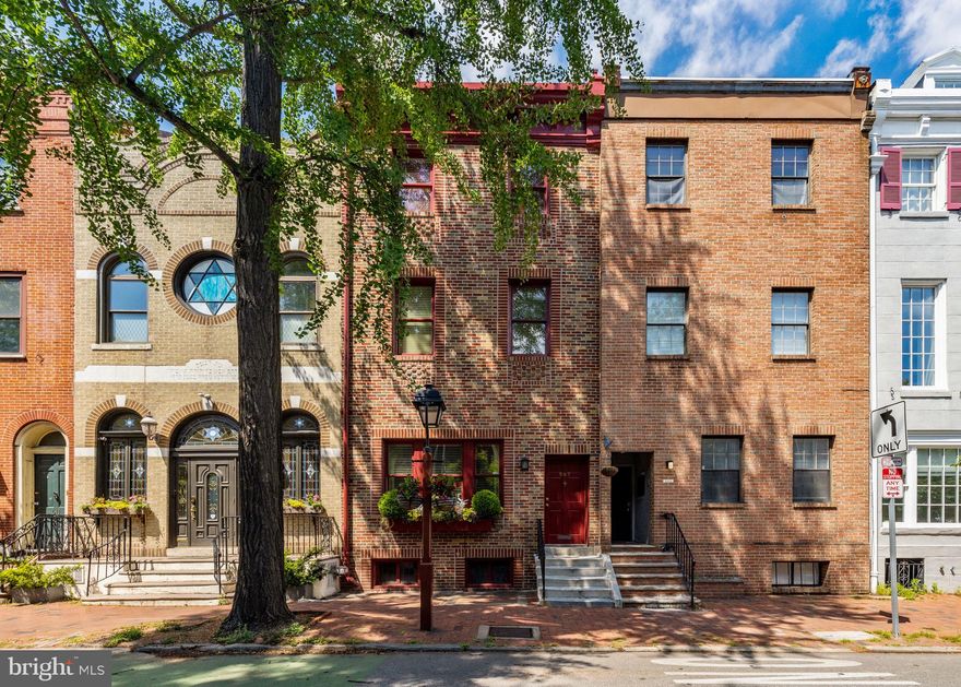 507 Pine -- Sitting on an 18 by 78 foot lot with beautiful curb appeal. Roughly 3200 sqft over 4 stories.  This home has a terrific layout, an airy bright feel and beautiful scale throughout. 10 foot ceilings on the 1st floor with a wide open layout and a gas fireplace. The galley chef's kitchen features a center piece 6 burner range + griddle with exterior ventilation and opens to one of the best backyards in the City. Designed by renowned landscape architect Victoria Steiger this 400 sqft + backyard offers two levels, built-in Ipe seating, irrigated planters, a custom trellises and is flanked by stunning and glistening stained glass windows. A perfect and ideal backdrop for Al Fresco dining. Bonus: direct access to 5th St from the backyard ally. On the 2nd floor you'll find the luxurious primary bedroom overlooking the trees along Pine (southern light), an office and a powder room. Up a level on the 3rd floor you'll find a guest bedroom, a 4 piece guest bathroom and an enormous secondary living room. On the top floor you'll find an additional guest bedroom, a powder room and a study. The study can easily be used as a den or closed off creating another bedroom. A special combination of historic charm and modern amenities. This lovely home offers layout flexibility. Attractive oak floors run the entirety of the home along with detailed millwork & moldings throughout... Features you want and expect in a Society Hill abode. A partially finished basement that includes a wet bar and powder room offers additional usable square footage. A top block in Society Hill and only 2 blocks from Washington Square. For the ultimate convenience you are located just around the corner from the neighborhoods grocery store (Acme) A home not to be missed. McCall School Catchment! *2 kitchen photos show a virtually renovated kitchen to give you an idea of what a newer white kitchen would look like in the space.