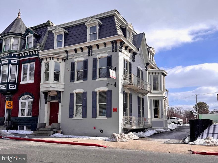 Discover the timeless elegance and exceptional potential of this grand Colonial residence, ideally positioned to capture the best of downtown living. Previously used as an accounting firm/office. Offering an impressive 4,248 square feet, this stately home showcases remarkable architectural character rarely found today — from floor-to-ceiling and bay windows to pocket doors, interior shutters, leaded glass accents, and beautifully detailed ceramic tile. Inside, the gracious living and dining rooms are separated by pocket doors and provide the perfect setting for entertaining, while the upper level features five generously sized bedrooms, offering flexibility for family living, guest accommodations, or home office space. With some updates and personal touches, this property presents a wonderful opportunity to enhance its historic beauty while adding modern comfort and value. Outside, charming sidewalks frame the property and contribute to the neighborhood’s classic appeal. Off-street parking and convenient driveway access make daily living effortless — a true advantage in this sought-after downtown location. Situated in a vibrant community within walking distance of Meritus Park (The Flying Boxcars baseball stadium), local parks, downtown coffee shops and restaurants, schools, and The Maryland Theater, this home offers both character and convenience. Whether you’re looking for historical brilliance or to thoughtfully modernize its interiors, this remarkable residence is ready to become something truly special. The seller is offering $20,000 in seller concessions! Property is zoned CCMU - buyer to verify residential use.