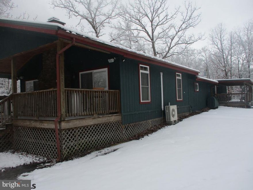 Beautiful cabin on 20 acres over looking Black Moshannon Creek (stocked) and borders RAILS to TRAILS. The cabin offers 2214 square feet of living area. The property offers several heat sources: oil forced hot, split heat pumps with central air, L.P. gas wall units and a fireplace. Full bathroom with shower. L.P. gas refrig and stove. Enjoy the large family room with fireplace, big screen T.V. and pool table. The property has three covered porches, one overlooking the fishing dock the other enjoy watching the Rails to Trails activities. Enjoy the 15' x 34' covered pavilion next to the open yard and creek. Ideal property and location only 15 minute drive to Black Moshannon State Park which offer swimming, boating and all of the Parks activities. Call for complete details.
