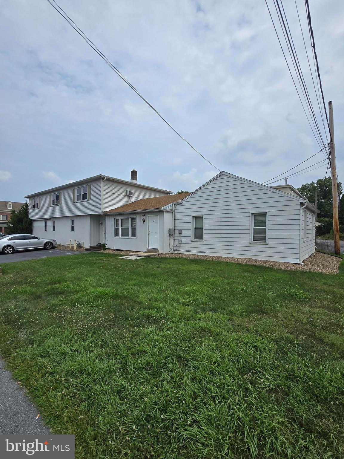 Wonderful Investment/Owner-User Investment Opportunity!! Fully leased 3-unit building. Currently three leased residential units. Main level unit could be converted back to several commercial uses which makes this property perfect for an owner-user who wants steady rental income from the other two units. Off-street parking lot for tenants and potential customers. All units are separately metered. Full unfinished basement great for storage, and in-building laundry adds to the amenity-value for the tenants. Newer roof, gutters, repaved parking lot and windows. Don't hesitate to schedule your showing today!