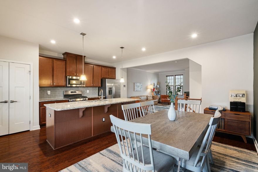 Welcome to this like-new 3-bedroom, 2.5-bath brick front townhome in Potomac Shores, Dumfries, VA, one of Northern Virginia’s most sought-after resort-style communities. If you are searching for a Potomac Shores townhome with a 2-car garage, extra guest parking, an open concept layout, and privacy, this home delivers.This is the lowest priced townhome  in Potomac Shores it has a view of mature trees and backs to open green space, a rare setting in today’s townhome market. Homeowners enjoy an HOA with resort-style amenities and no separate condo fee.Inside, the open-concept floor plan features hardwood floors throughout the main level and stairs,  brand new carpet throughout, fresh paint, craftsman-style doors, crown molding, recessed lighting, and abundant natural light. The gourmet kitchen features granite countertops, stainless steel appliances, a glass-tile backsplash, and a large center island with pendant lighting. The breakfast area opens to a composite deck overlooking open space.Upstairs offers three spacious bedrooms, including a primary suite with a tray ceiling, a walk-in closet, and an upgraded ensuite bath with dual vanities and tile. Upper-level laundry adds convenience for everyday living.The entry-level flex space is ideal for a home office, gym, or recreation room and provides direct access to the oversized two-car garage.Living in Potomac Shores means access to a resort-style community pool, Fitness and Social Barn, basketball courts, walking trails, golf course, and community events. Future VRE station and Marketplace retail in Potomac Shores enhance long-term value and commuter convenience to Quantico, Fort Belvoir, and Washington DC.If you are searching for a move-in-ready townhome in Potomac Shores, Dumfries, VA, with garage parking, guest parking, privacy, and amenities, this home is a must-see.