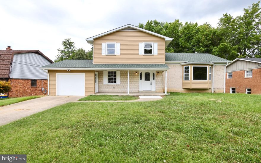 Nestled In The Heart of The Brookwood Community Here In Upper Marlboro, This Gorgeous Brick Colonial Boasts 5 Spacious Beds, 3.5 Fully Renovated Baths, and So Much More.,, From First Step, Beautiful Cherry Hardwood Floors Throughout, Upgraded Lighting, Custom Iron Work, Spacious Entertainment/Living Rooms, and A Stunning Fully Upgraded Kitchen....Not To Forget The Enormous Basement Space With Separate Rear Entrance, and Ready To Serve As A In-Law Suite and/or Income Producing Rental.... Beautifully Finished With Ample Yard Space, Rear Patio Space, and a Grand Deck... Don't Miss Out
