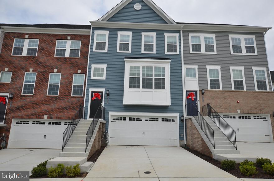 Brand new spacious and bright townhome, is the largest Easton Model located on a premium lot in Patapsco Glen new community. 3 above grade levels. Front entry 2-car garage, with 240V Fast EV Charge Port Installed in garage for your convenience! Large driveway can park more cars. Ground Level has 4th bedroom, and 3rd full bath. Main level kitchen with stainless steel appliances, extra large island, marble counter tops, gourmet gas stove with upgraded vent hood, double oven. Living, dining room combo. Half bath. Sliding door off living room leading to large deck. Upper level with 3 bedrooms 2 full baths, with upgrade vanities, large ceramic shower and floor, washer & dryer. Extra wide stairs and hallway. Great view from front and rear windows. Faux wood blinds on all windows. Abundant of lighting through-out the whole house. Plenty of parking space. Community pool is available for summer fun! Be the first to Occupy this brand new home! Please remove shoes during showing.