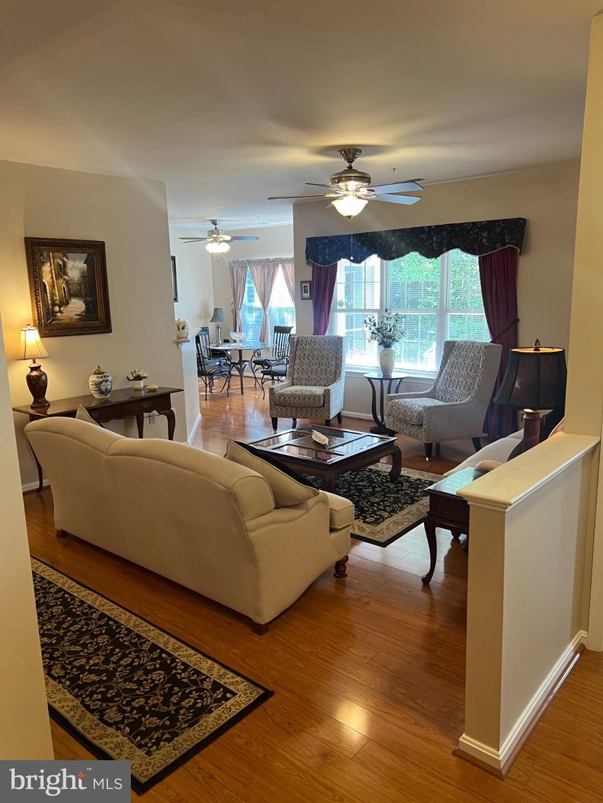 Nestled in the prestigious Hopkins Landing community, this exquisite 2-bedroom, 2-bathroom condo offers a harmonious blend of luxury and comfort. Step inside to discover a thoughtfully designed interior featuring luxury vinyl plank flooring that flows seamlessly throughout. The spacious kitchen, equipped with high-end appliances including a built-in microwave, gas range, invites culinary creativity. Enjoy meals in the charming breakfast area or the elegant dining space, perfect for entertaining. The master suite boasts a walk-in closet and a spa-like bathroom with a walk-in shower. Additional features include ceiling fans, a traditional floor plan, formal dining room, and plenty of closets and storage space enhancing the home's functionality. Outside, the community amenities are unparalleled. Take a refreshing dip in the heated, in-ground pool or stroll along the scenic bike trails and jog/walk paths. The beautifully landscaped grounds, complete with sidewalks and plenty of open space, create an inviting atmosphere. This condo backs onto open common areas, offering picturesque views of the woods, common spaces, and a pond with a fountain. With year-round access to nature's beauty, this property is a sanctuary for those seeking an exclusive lifestyle. Conveniently located near transportation options, shopping, restaurants, and essential services, this home is a perfect blend of luxury living and accessibility. Experience the tranquility and elegance that this remarkable property has to offer. HVAC was replaced in 2022 and water heater was replaced in 2024.