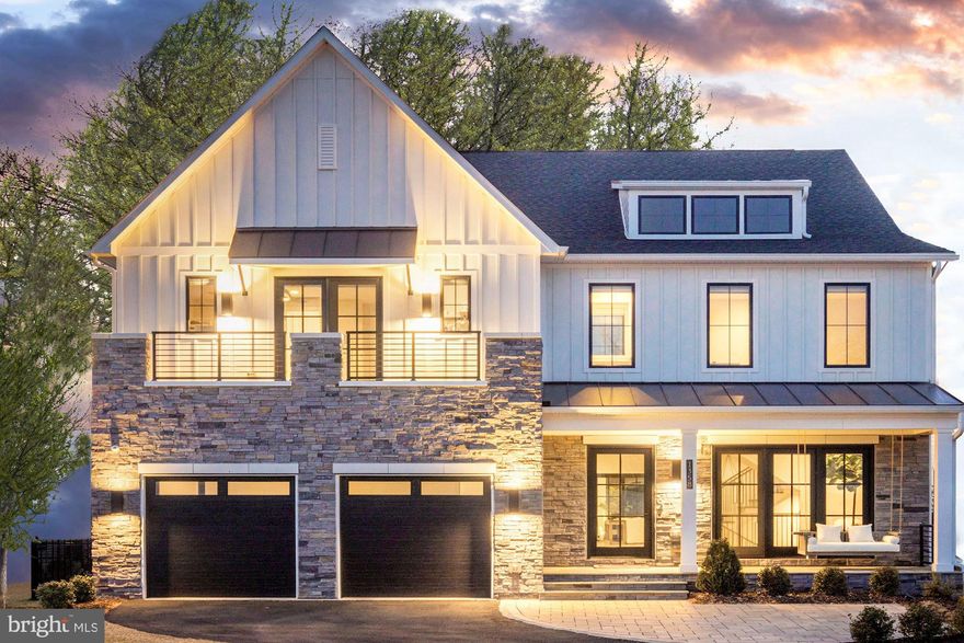 This two year old stunning Modern Farmhouse features the best in architectural features with custom curated finishes and designer appointments throughout the 8900 sf of living on four levels.  The spectacular open floor plan is highlighted by  a dramatic squared floating spiral staircase  and a grand foyer with views all the way to the backyard.  This luxury home, with top of the line finishes, is sited on a premium lot backing to trees with a fenced backyard with an expansive flagstone terrace with a fire pit and built-in grill.

Nothing was spared in the construction of the house which features hardwood floors throughout, oversized windows, 10' ceilings, three covered porches and custom designed systems in the bedroom closets and 1400 sf of outdoor living space.

The Main Level includes:  A Great Room with a 60 in linear gas fireplace and a 12 ft multi-panel pocket door opening to the porch allowing your entertainment space to transition from the inside to the outdoors   A well appointed gourmet kitchen with a sleek white on white look with quartz countertops and quartz backsplash has an amazing oversized center island with eat-up breakfast bar.  The kitchen is equipped with a Wolf range, 72" Subzero refrigerator and freezer, a dishwasher, three ovens and one microwave and a built-in Wolf coffeemaker with bean grinder   Adjoining the kitchen is a catering kitchen with a dishwasher and sink and large walk-in pantry and in addition there is a Butler's pantry with a sink and wine cooler   Conveniently located between the kitchen and mudroom is a communication nook with a built-in desk for dropping your keys and mail    The mudroom/laundry area has a built-in bench with cubbies overhead and underneath   The area is complete with a walk-in closet and linen closet    The Dining Room with a tray ceiling with accent lighting .

The Upper Level includes: A luxury owners suite has its own private covered porch, a spa-like marble bath with a large walk-in shower with a built-in bench and two doors and a show piece free standing soaking tub as well as dual vanities and a generous custom designed, walk-in closet with huge center island  and suitcase closet    Three en suites with walk-in closets of which the guest suite has it's own balcony   In addition this level features an open family room that includes a coffee bar with a refreshment refrigerator    Second laundry room.  

The Loft level includes: Fifth bedroom with full bath   Flex room or playroom with glass door to covered rooftop deck and open deck offering great vistas.

The Lower level includes: Ten foot ceilings and French doors to walkup stairs    Light filled expansive Recreation Room with wet bar equipped with dishwasher, refreshment refrigerator and sink enhanced by accent lighting    Six bedroom and full bath   Ballet / dance nook    Game room or play room    Exercise / Media Room    Under stair cubby for playing or storage.

The Retreat in McLean is in a very convenient location just minutes to Tysons, the Silver Line, 495 and the Toll Road as well as Tysons Mall, the Galleria, the Boro and the new performing Arts Center at Capital One Hall.  Monitor Lane is just blocks to the McLean Central Park, library and community center.  It is just minutes to Scotts Run Park and Great Falls National Park with paths for hiking or walking along the scenic Potomac River.  The location is equidistant to Reagan National and Dulles International Airports.