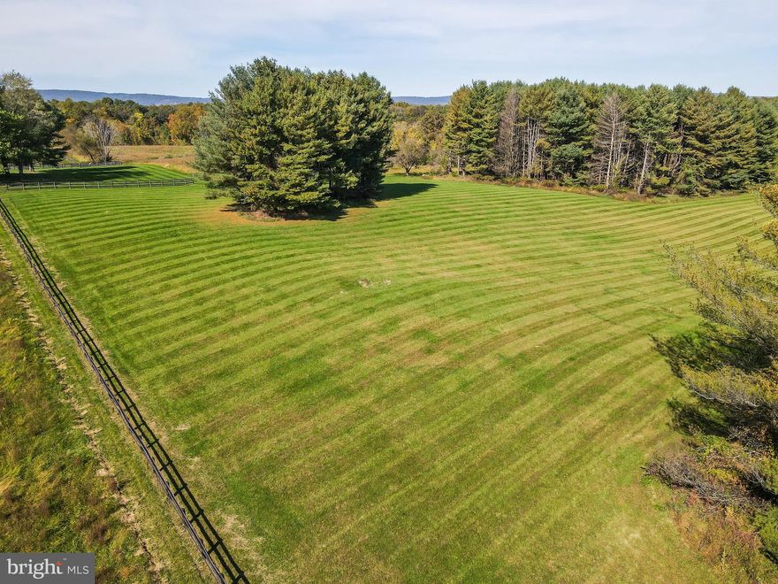 Gorgeous 5 acre building lot, with 4 Bedroom Perk and Beautiful Views, a mixture of grassy fields and wooded land, with a picturesque small stream.   Build your dream home that offers both privacy plus a convenient location off of a paved road.  5 minutes to Purcellville and 20 minutes to Leesburg! Shares Entrance easement  on property line with lot 25B next door. See Documents for details.