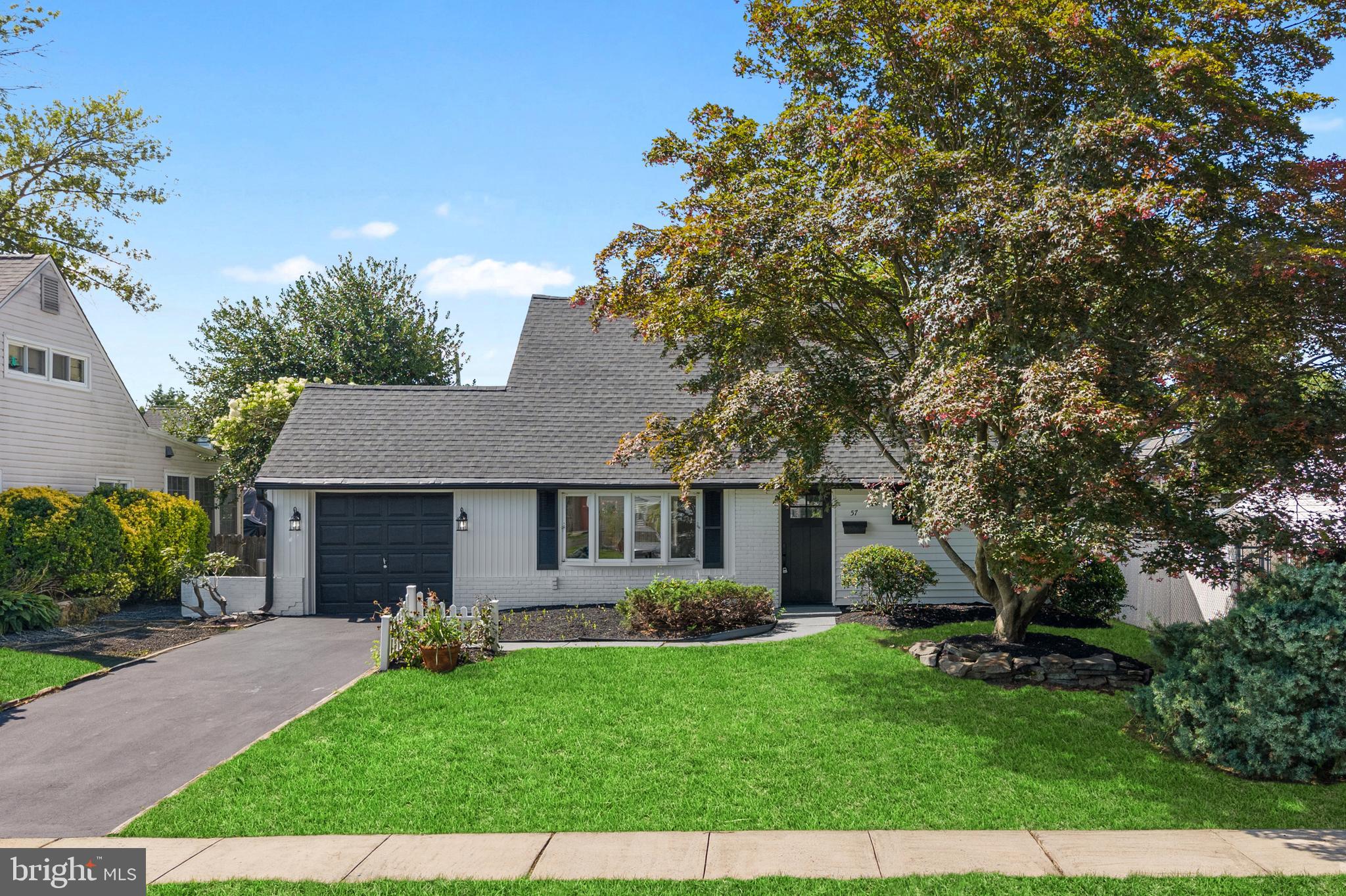 WOW… Welcome home to 57 Middle Road — the one you’ve truly been waiting for! Perfectly nestled in the heart of Bristol Township, Levittown, this stunning residence has been completely reimagined from top to bottom, blending timeless charm with modern luxury. From the moment you arrive, you’ll be captivated by the gorgeous curb appeal, elegant landscaping, spacious driveway, and the perfect backyard oasis featuring a charming patio — ideal for summer evenings and entertaining under the stars. Step inside and you’re greeted by an airy, light‑filled living room that flows seamlessly into a gracious dining area, creating a welcoming space for family gatherings and celebrations. The kitchen is a true showstopper, boasting sleek stainless steel appliances, custom tile backsplash, stylish two‑tone cabinetry with abundant storage, and striking upgraded quartz countertops that make both everyday meals and entertaining feel special. The main level also features two generously sized bedrooms and a beautifully appointed full bath, where designer finishes and custom tilework add a spa‑like touch. Upstairs, discover two additional spacious bedrooms paired with a second exquisite full bathroom, offering flexibility for guests, a home office, or your own peaceful retreat. Thoughtfully upgraded throughout — including brand-new HVAC, new flooring, new doors, and completely new bathrooms and kitchen — every detail has been crafted to offer style, comfort, and peace of mind. Perfectly located near shopping, dining, parks, and major roadways for easy commuting, this move‑in‑ready home brings together the best of convenience and refined living. Experience the warmth, beauty, and thoughtful design that make this property truly special. Don’t miss your chance to make it yours — schedule your private tour today and fall in love!