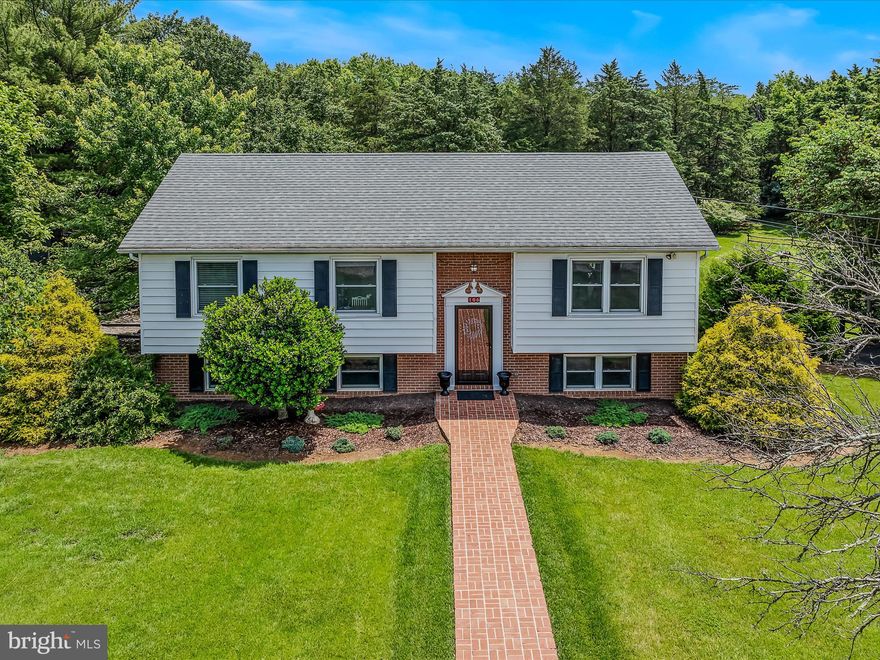 Discover this beautifully updated home nestled in a quiet, serene setting—perfect for those who crave both style and space. Inside, you'll find a bright open-concept layout featuring modern, neutral finishes that create a warm and inviting atmosphere throughout. The main living areas flow effortlessly, ideal for entertaining or cozy nights in.

Step outside to experience what truly sets this property apart. A powered awning extends over the expansive back deck, offering shade and comfort for outdoor dining or relaxing. The lush, parklike grounds are a dream come true for landscapers and gardeners, with mature trees, vibrant plantings, and thoughtfully designed spaces around every corner.

A 100-gallon propane tank fuels efficient cooking and some utilities, and the powered shed offers the perfect space for hobbies, a workshop, or extra storage. The circular driveway adds charm and convenience, while the tranquil pond creates a peaceful retreat right in your backyard.

This home combines modern updates with natural beauty—don't miss your chance to enjoy the best of both worlds in a truly special property.