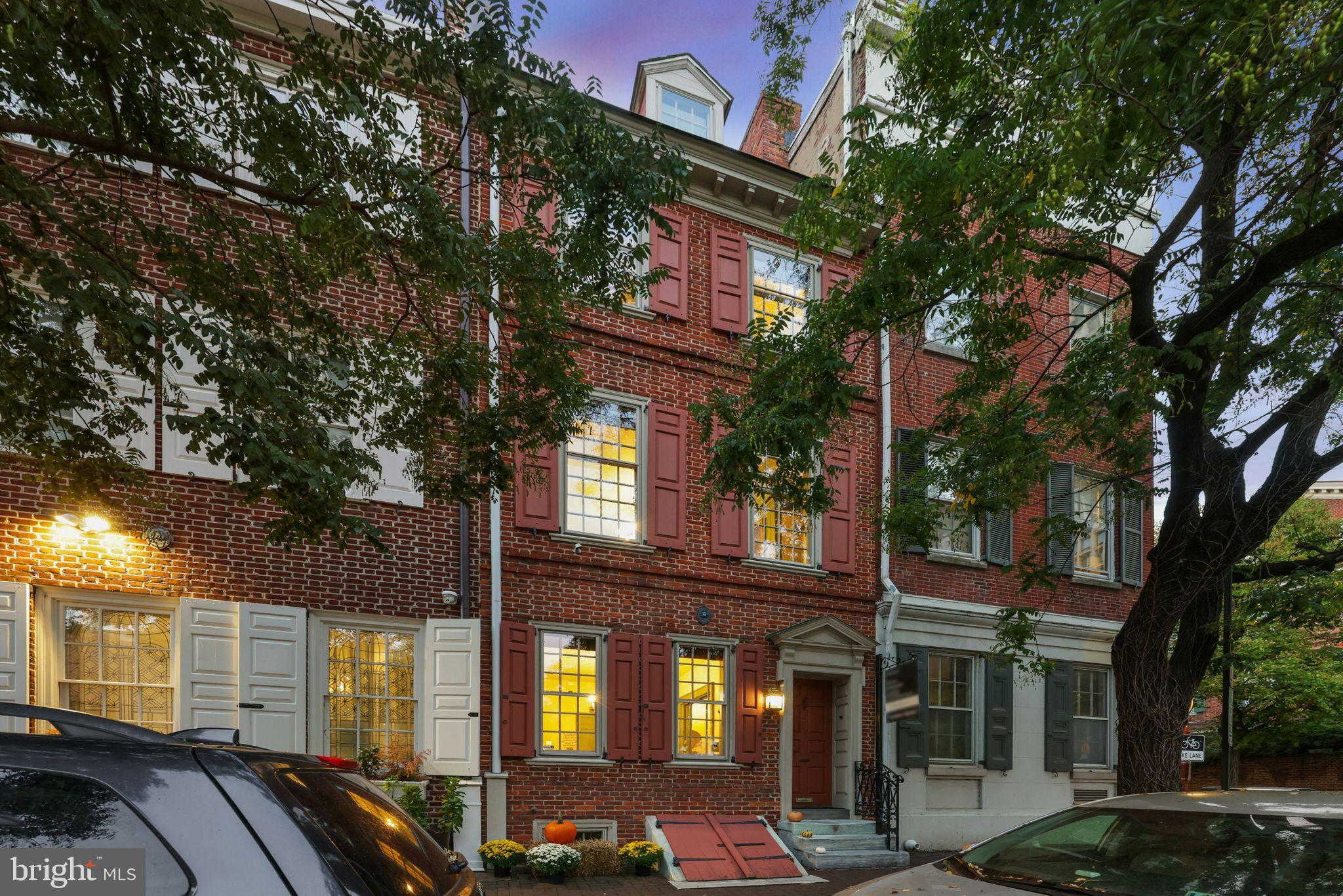 Step into a timeless journey as you become the next steward of one of Philadelphia’s last old-world legacy homes. Nestled in the heart of historic Society Hill and resting on a 16x92 lot, this exquisite Federal-style residence, circa 1762, offers a rare opportunity to own a piece of the city’s storied past. Located on one of the area's prestigious cobblestone streets, this property is not just a home but a piece of history that seamlessly intertwines with modern luxury.
As you enter through the grand foyer, you are greeted by an aura of old-world sophistication, a testament to generations of careful restoration and love. The original hardwood floors and meticulously restored millwork whisper tales of the past, while the lofty ceilings on each floor add a sense of grandeur. The ultimate in privacy, the lush, mature gardens surrounding the home create a serene oasis in the city.
The heart of this home is undoubtedly its expansive kitchen, a culinary haven equipped with state-of-the-art appliances, including a wine fridge, subzero refrigerator with a two-drawer freezer, and a vented 5-burner gas stovetop. The kitchen, adorned with an exposed painted brick wall, flows seamlessly into a beautifully landscaped courtyard. Here, a Pennsylvania Bluestone patio awaits, complete with a built-in BBQ area, outdoor refrigerator, and a Weber grill set amidst mature, lush landscaping at every corner. This outdoor space is ideal for year-round entertaining.
On the first floor, a formal dining room with elegant pocket doors sets the stage for intimate gatherings, while a convenient powder room is thoughtfully placed nearby. Ascend the wide, gentle classical staircase to discover the second, third, and fourth floors, where generously sized bedrooms and luxurious bathrooms await. The master suite is a sanctuary of comfort, complete with a cozy fireplace and exquisite finishes.
The second floor invites relaxation in a living room overlooking 2nd Street, complete with built-ins and a fireplace prepped for clean, warm fires. The floor also features a library with abundant storage options, a butler pantry with a wine fridge, and access through French doors to an intimate deck overlooking the gardens and courtyard below.
Additional features include a coffee bar off the library, ample storage throughout, custom built-ins providing both style and additional storage options, and a finished basement providing practical storage and a laundry area. This home could easily accommodate a buyer seeking a 5-bedroom property, offering flexibility and space for various living arrangements.
Located in the vibrant Society Hill neighborhood, this home offers a lifestyle rich in culture and convenience, with an array of restaurants, theaters, and cultural venues just steps away. As a bonus, the property is within the desirable McCall School catchment.
More than just a home, this is an irreplaceable legacy property waiting to welcome its next steward. Let it capture your heart as it becomes part of your family’s history, offering a picturesque blend of historic charm and modern elegance right in the heart of Society Hill. *The seller is offering a one-year prepaid parking space at a nearby garage, enhancing the convenience of city living.