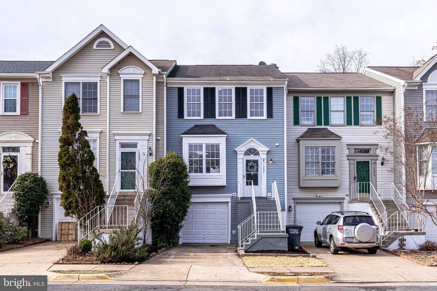 Welcome home to Paradise! Walk through the front door of this 3 bedroom townhome and revel in this complete remodel from top to bottom. Why wait on new construction when this home has been entirely renovated and is available today? On the main level you’ll discover gorgeous modern laminate floors (2023) that continue throughout the light and airy spaces. The living room features an idyllic picture window and is open to the dining room, making it a fantastic space for entertaining. Inside the eat-in kitchen (renovated 2023) you’ll find a sleek, contemporary space with a subway tile backsplash, stainless steel appliances, white shaker style soft-close cabinets, an expansive breakfast bar and fireplace. Upstairs, brand new plush carpet leads you to the bedrooms. The spacious main bedroom retreat boasts impressive vaulted ceilings, multiple large closets, and a ceiling fan. The en suite bathroom is an updated (2023) dream come true, with a double vanity, deep sinks, modern fixtures, sophisticated tile,  skylight, and a gigantic walk-in shower with niche. Down the hall, two additional bedrooms include an abundance of closet space and the same soft carpet under your feet each morning. The full hall bath is clean, modern, and fully renovated (2023) to match the main bathroom. In the lower level of the home you’ll find a large recreation room - a perfect second living space that could be used as a home office, den, guest space or gym. A sizable laundry room, powder room, additional storage under the stairs, and garage access can also be found on this level. Off the kitchen, you can step out onto your deck and enjoy your private backyard, covered with fresh sod. The driveway and one car garage provides ample parking and storage. New paint and flooring throughout. Neighborhood amenities include a community pool, club house, and tennis courts. Minutes to Amazon Fresh, Lidl, Costco, Bull Run Plaza, Manassas Crossroads, Westgate Plaza, Bull Run Park, Manassas Battlefield, Bull Run Winery, Jiffy Lube Live and Linton Hall. Quick access to Rte 66, Rte 234, Rte 28, Rte 29, and Sudley Manor Dr. With all of these updates, this home is like new and won’t be available for long. Come check out your new home today! **Offer deadline 2pm on 1/16**