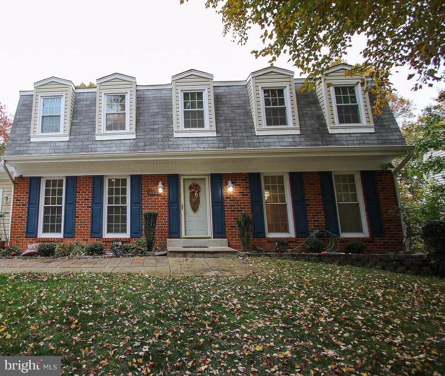 Move in ready ! Popular center hall colonial features 3 levels, 4 br, 3.5 ba w/ finished walk-out basement with rec rm, den w/ closet & full bath. Hardwood on main & upper level, upgrade kitchen w/ granite counter, island cooking & range hood. Spacious master suite with walk-in closet. Sliding door to large deck & fully fenced yard. Freshly paint,