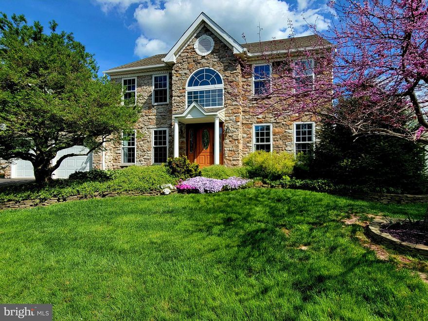 Get ready to enjoy summer in the home you have been waiting for! A backyard oasis awaits in this truly exceptional home and location in the beautiful community of Hearthstone!  This house boasts a premium lot with a large dedicated open space field directly behind and a cul de sac in the front. Upon entering you will appreciate the grand two-story foyer including an updated turned staircase with iron balusters and wood treads, hopscotch style ceramic tile, custom crown and chair moldings and wainscot.  The formal dining room includes a doorway with enhanced moldings, 4" wide plank Mohawk hickory hardwood flooring, wainscot, crown and chair moldings, recessed lighting,  and upgraded 5” baseboards.  The convenient office has mohawk hardwood floors (2021) and pretty back yard views. The formal living room features 4" wide plank hickory hardwood flooring, wainscot, crown and chair moldings and millwork enhanced doorways. The spacious kitchen has been renovated and includes honey cherry upgraded cabinets, granite counters, custom interior pull out shelves, ceramic tile backsplash, secondary prep sink in the island and under mount cabinet lighting.  All the appliances are stainless steel including a GE french door fridge (2022), Bosch dishwasher (2023), gas Viking range with stainless hood and a GE Profile microwave convection oven.  The breakfast room has lovely thick paneling, an Anderson sliding door and upgraded lighting.  The laundry room was fully remodeled in 2023 to maximize storage space featuring custom soft close cabinets,  black utility sink with pull down sprayer and an oversize GE washer and gas dryer.  The inviting family room has a vaulted ceiling, recessed lighting, built in surround sound speakers and Brazilian hardwood flooring.  Premium french doors lead to a sunny 20 x 14 sunroom addition with Anderson windows, a Harmon wood pellet stove, high cathedral ceiling with two skylights, Anderson sliding door and a handy crawl space for storage.  The backyard is a truly gorgeous space with extensive stamped concrete hardscaping and patio, in ground pool with a heater and a stone outdoor kitchen with a granite counter featuring a direct gas line firemagic grill.   While you relax or entertain by the pool you'll notice the landscaping was designed with privacy and beauty in mind, plus there is a built in firepit, a roomy shed and a premium powder coated aluminum fence.   The back gate leads directly to a large, lush  dedicated open space field. In the spacious master bedroom you will find a linen closet, lighted ceiling fan, walk in closet and newer carpet throughout all the bedrooms (2021) .   The primary bathroom has been upgraded and has a "canyon creek" stone feature wall, radiant heat ceramic tile flooring, double sink custom cherry vanities with linen storage, a tile shower with three shower heads and a built-in seat.  Completing the second floor are three other newly painted (2023) bedrooms, a hall linen closet  and an updated hall bath including ceramic tile flooring, custom tile bath surround and wood vanity with granite top.
All the windows (except the sunroom and foyer) were replaced with premium vinyl windows in 2022.  There are so many other great details: upgraded flagstone front walkway and front porch area, impressive outdoor up lighting and landscape lighting, upgraded front wood door and side lights, keypad access, ring doorbell, leaf gutter guards, central house vacuum, premium garage doors and a water softener.  Located just minutes from the charming downtown of award-winning Doylestown you will find commuting convenience just minutes away from major PA connecting routes making traveling to Center City and New Jersey effortless. Not only do we have walkable parks and nearby retail, but we are also in the blue ribbon Central Bucks school district.   Schedule a tour of this awesome home today!  Seller is a licensed Agent.