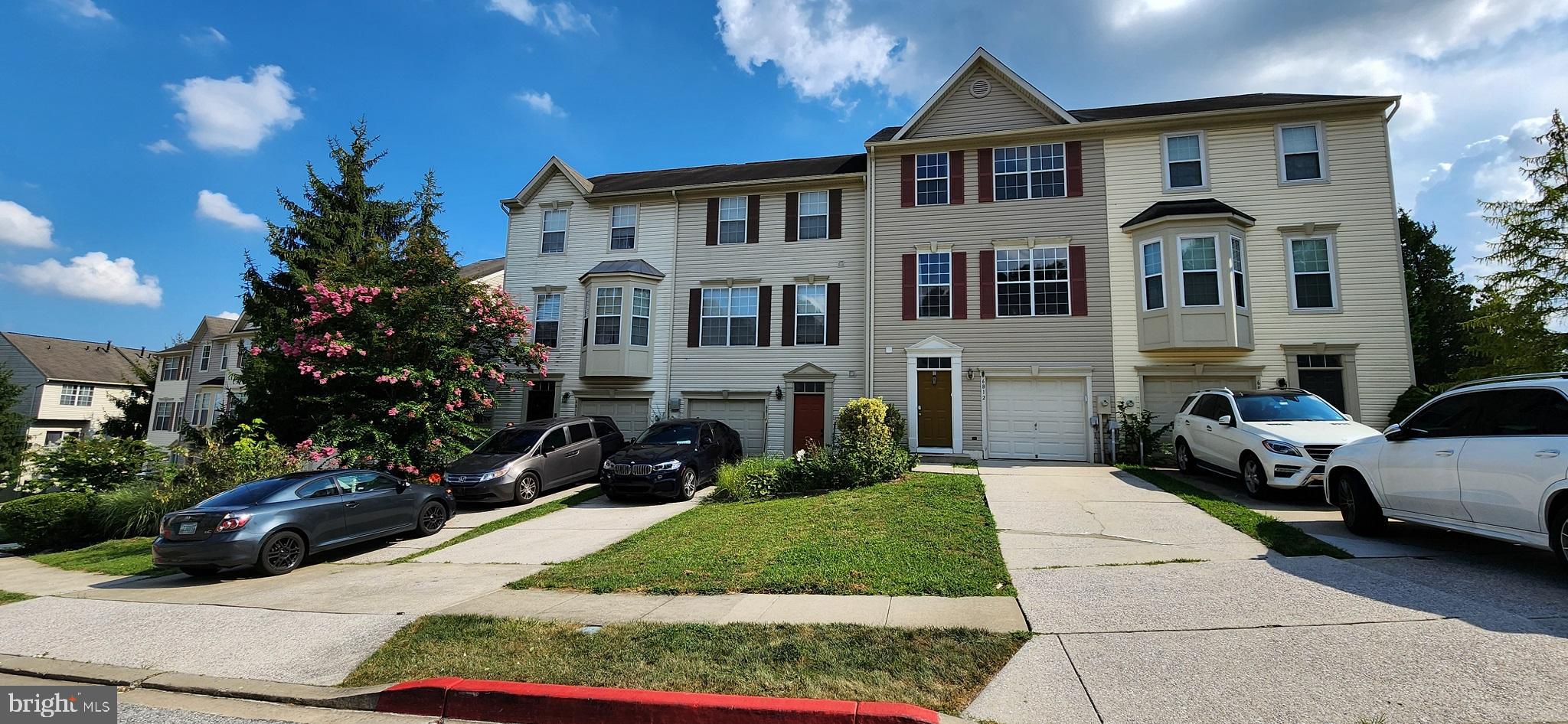 Fully upgraded townhome featuring 3 bedrooms 2.5 baths with 1 car garage in Elkridge. Owner has made numerous modern updates to this home! In the kitchen, find updated quartz countertops, custom tile backsplash, pendant lights over the breakfast bar, Stainless Steel appliances including refrigerator, dishwasher, flat top stove and built-in microwave. All floors have been updated to hard surface flooring including the staircases - laminate plank floors throughout main and upper (bedroom) levels plus hardwood and ceramic tile floors on the entry (lower) level. Lighting fixtures have been updated and ceiling fans installed in dining room and primary bedroom. Both full bathrooms have been fully upgraded to modern vanities, modern lighting and decorative vanities with ceramic tile floors plus ceramic tile showers each with a built-in niche. Primary walk in shower includes a handheld and rain/waterfall shower option. Enter the home from the front door or interior front facing garage. On the first level, there is a family room, half bath plus laundry and utility closet and access to the rear deck overlooking trees. Walk up to the great room on the main level, with an open concept floor plan allowing for many different configurations for living / dining / entertainment space. The kitchen has white cabinetry, breakfast bar and pantry with breakfast room providing access to the 2nd floor balcony deck. Upstairs, find 2 full bathrooms and 3 bedrooms. The primary bedroom has a walk-in closet and an attached en-suite bathroom. 2 car spaces in driveway. The home is conveniently located off 95/175 with quick access to Routes 295, 1, 32 and Fort Meade / NSA. Quick access to major shopping including Costco, ALDI, Lowe's, Best Buy, Target and more or just a short drive to Downtown Columbia featuring Merriweather Post Pavilion, The Mall in Columbia, Lake Kittamaqundi, shopping, restaurants and more.