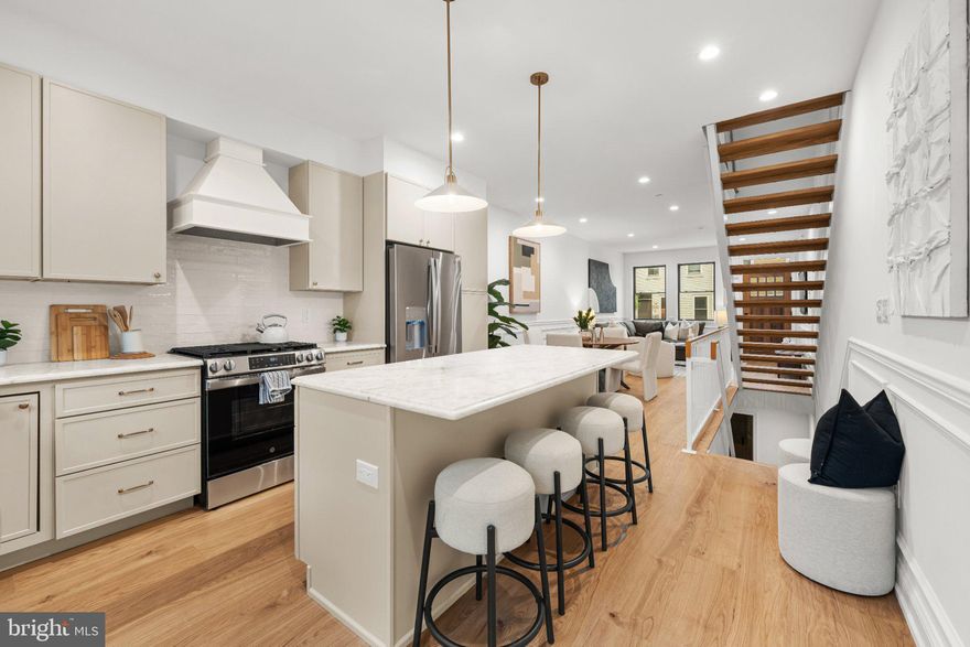 Welcome to 2240 Oakford Street, a stunning 2,100 sq. ft. custom-built home located in the heart of Point Breeze just two blocks from Washington Ave. This 3-bedroom, 3-bathroom new construction showcases exceptional craftsmanship and luxury living, with convenient access to Center City, Rittenhouse Square, and I-76. Step inside to an open-concept living area featuring engineered hardwood floors and a gourmet kitchen equipped with custom cabinetry, a spacious island, and stainless steel GE appliances. The private backyard is ideal for entertaining, offering artificial grass, and plenty of space for outdoor seating. The second floor features a large guest bedroom , a spacious walk-in laundry room with full sized side by side front load W/D included, a large hallway bathroom with a tub/shower and double vanity, and another generously sized bedroom at the end of the hall. The primary suite includes a luxurious bedroom, a massive walk-through closet with custom built-in shelving, and a spa-inspired bathroom with a double vanity and a large glass-enclosed shower. Just outside the primary bedroom, enjoy access to a front balcony or head up to the expansive rooftop deck, offering breathtaking panoramic views of the city skyline, stadiums, and bridges. The finished basement provides a full bathroom and flexible space for an optional fourth bedroom, office, or entertainment area. Additional highlights include a 10-year tax abatement and a 1-year builder’s warranty. Don’t miss this rare opportunity to own a luxury home in the vibrant Point Breeze neighborhood.