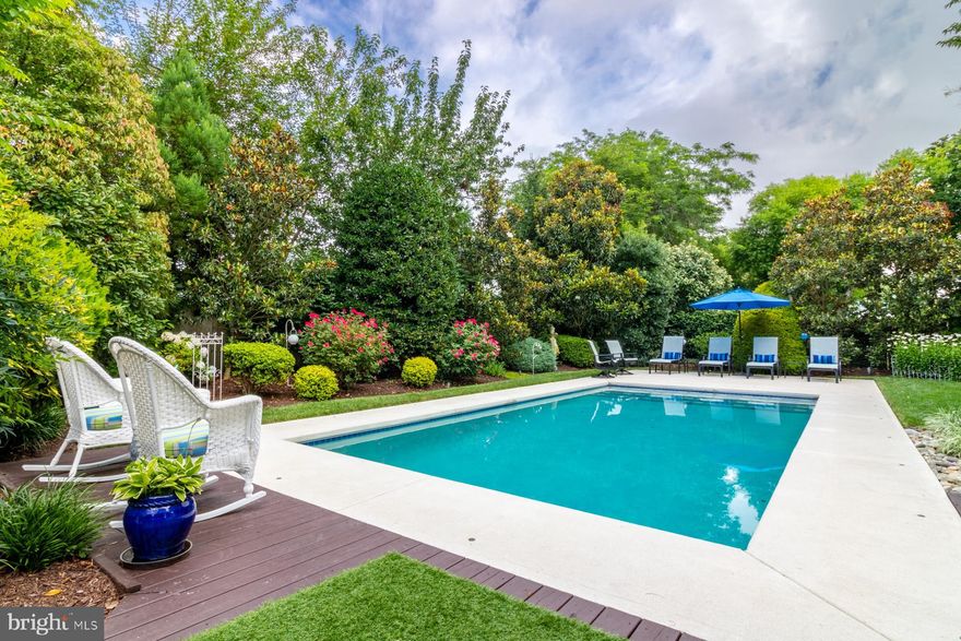 Located just six blocks from the beach and boardwalk, this exceptional in-town residence offers the perfect blend of sophistication, privacy, and resort-style living. Set on an expansive 100x175’ lot, the property boasts 8 bedrooms, 5 bathrooms, two garages, and a newly renovated 15x30’ heated in-ground pool—creating your own private oasis just minutes from the heart of Rehoboth.
Step into the beautifully landscaped rear yard, where curated gardens and expert hardscaping combine to create a true outdoor sanctuary. Lush greenery, landscape lighting, and pergolas draped with blooming vines offer a magical setting day and night. Multiple outdoor dining and lounge areas invite you to relax, entertain, and dine alfresco under the stars.
The main level features an open-concept kitchen, dining, and living area with panoramic views of the garden and pool, along with two king-sized bedrooms. Completing this level is a spacious, climate-controlled screened porch with brick flooring and a vaulted cedar tongue-and-groove ceiling—ideal for indoor-outdoor living year-round.
Upstairs, you’ll find four additional bedrooms, including a generous primary suite with spa bath, soaking tub, and separate shower. The lower level includes a 2-bedroom guest apartment with a full bath, kitchenette, and private entrance—perfect for hosting overflow friends and family.
The property also features both an attached and detached two-car garage, offering abundant storage for bikes, scooters, kayaks, boards and your beach Jeep.
Enjoy the best of both worlds: the convenience of walking or biking over Turtle Bridge to the beach, shops, and Rehoboth’s award-winning dining scene—paired with the privacy and amenities of your own personal resort.   This property has been a proven and popular vacation rental generating over 13K in weekly rental revenue.