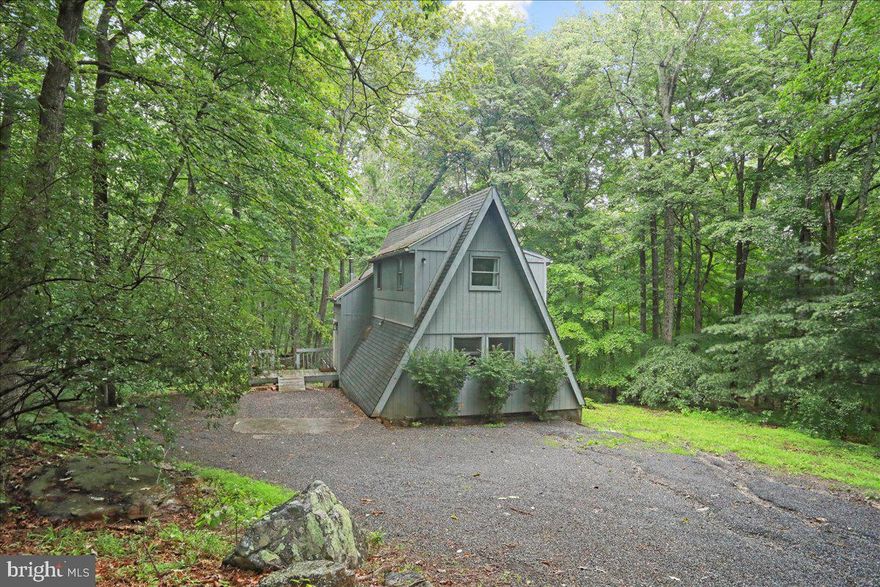 Charming A-Frame cabin in Coolfont Mountainside Community
This A-frame home is nestled in the peaceful and highly sought-after Coolfont Mountainside community and would perfect as a full-time residence, vacation home, or short-term rental investment.
The home features 4 bedrooms, 4 bathrooms, a traditional floor plan filled with natural light, and a fully finished basement offering extra living space. The inviting living room with a cozy woodstove sets the tone for relaxing evenings, while the wet/dry bar in the basement makes entertaining effortless.
As a resident of the Coolfont community, you’ll enjoy access to a range of amenities including a seasonal outdoor pool and Hot tub, year round Tennis & basketball courts, Walking trails and scenic surroundings.
This home is also conveniently located just minutes from downtown Berkeley Springs.
