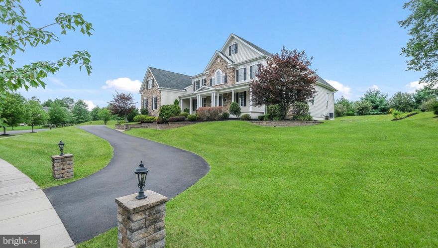 Welcome to the prestigious community of Spring Valley Estates located in Buckingham Township, in the award-winning school district of Central Bucks. You’ll notice what a special place this is the moment you begin driving through the community. 2754 Manion Way is perched high on a beautiful 1.28 picturesque lot with driveway pillars and a grand entrance. Step onto the covered front porch and enjoy your views. This popular Toll Brothers Henley model with 6293 sq ft of living space, 5 bedrooms and 5-1/2 bathrooms, will exceed your expectations. Enter into the majestic 2 story foyer to experience the dual curved staircases. There are custom moldings throughout that flow into the formal dining room and living room. Off to the right is the bonus first floor bedroom with a walk-in closet and full bathroom. This would be a great au pair suite, in-law suite or play room. Towards the back of the home is a 2 story family room with impressive box-beam detailing and floor to ceiling stone fireplace. The spacious kitchen is an entertainers delight featuring an oversized kitchen island, granite countertops, upgraded stainless appliances, including a 48” Wolf range with double ovens and built-in range hood, an additional wall oven and convection/microwave, a Bosch dishwasher, a butler’s area and a separate desk area. This overlooking the bonus sunroom addition with vaulted ceiling, stone fireplace, breakfast bar and a French door leading to your deck out back. The laundry is complete with washer/dryer on pedestals, custom cabinets and a wash sink. Let’s head up the oak staircase with upgraded metal balusters. The owner’s suite is spacious in size offering a sitting room with columns, a wonderful owner’s bedroom, 3 walk-in closets, another bonus room and a spa-like owner’s bathroom that you will feel pampered in. The owner’s bathroom comes with 2 vanities with granite countertops, 2 separate water closets, a focal soaking tub and a walk-in shower with 2 shower heads. You will not want for more. Three additional nice sized bedrooms with en-suite bathrooms complete the 2nd level. The unfinished lower level with a walk-up would be a wonderful space to finish, if needed. And if that isn't enough...this home has a whole house generator! The backyard is private and peaceful and a great respite to enjoy.  This home is just minutes to downtown Doylestown and New Hope. Near Routes 202, 313 & 611. Schedule your appointment today!