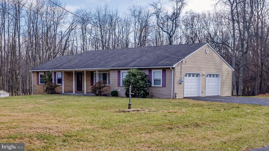 Multiple Offers. Highest & Best due 3pm Jan. 6th.
3 Acres! Great Charles Town location with privacy yet close to main roads for easy access & commuters. 3 bedrooms and 2 full bathrooms.  Over-sized side load garage with direct access to the basement. There is an additional garage bay on the basement level for car enthusiasts or additional easy storage access.  

The main level, from the front door, opens to the living room . Directly behind the the living room is a spacious kitchen with lots of cabinet space which directly connects to the dining room.  Down the hall you will find the the 3 bedrooms and the hall bathroom. The primary bedroom has a full bathroom. Both bathrooms have been recently upgraded.  Newer roof. Plenty of shopping within minutes.