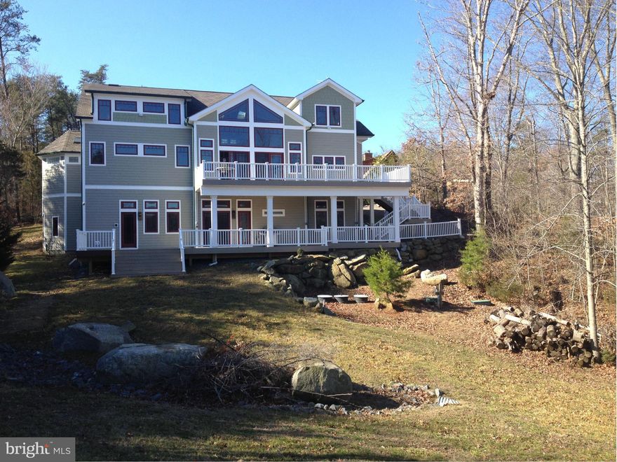 Custom designed Craftsman style is a must see with five grand master bedrooms w full baths, plus one full and two half bathrooms,three finished levels, a True Gourmet kitchen with all the extras.(sub-zero, Scottceran, Jenn air appliances and so much more).2 story living room overlooking the Lake Anna. Full HD Movie Theater, Laundry-room  on each level, amazing two level deck, boat house and beach.