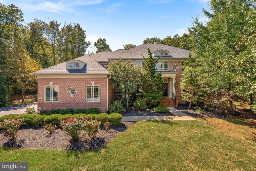 This meticulously maintained all brick home is nestled away at the end of a private cul de sac backing to mature trees which provides the ultimate privacy. Sitting on nearly 2 acres, this property has the feel of a secluded retreat while still being so close to everything Leesburg has to offer.

Step inside to discover newly installed engineered hardwood floors and fresh paint throughout that lead to a gourmet kitchen designed for culinary excellence. Equipped with a commercial-size Sub-Zero refrigerator and freezer, Wolf 48-inch cooktop with six burners, and double wall ovens,  The centerpiece is a stunning waterfall quartz island.

The formal dining room provides a sophisticated setting for special occasions while the casual family room is perfect for watching the game.  Retreat to the primary bedroom suite, complete with a separate sitting room and a linear fireplace. The remodeled primary bathroom boasts a standalone soaking tub, dual shower heads, and separate vanities for a spa-like experience.   There are 2 separate walk-in closets as well as a dressing area.   There is plenty of space for all offering the hard to find 5 bedrooms on the upper level as well as 4 full bathrooms.  

The spacious unfinished basement offers endless possibilities for customization, inviting your creative touch.   For entertaining outdoors, enjoy the expansive Trex deck and beautiful landscaping.  Brand new roof, hot water heater and lower level HVAC.