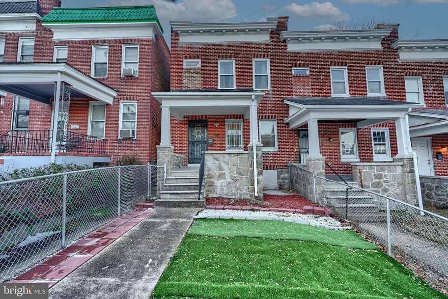 Lovely 3 bedroom 2 bath townhome with front porch and 2 car parking pad in rear. Natural hardwood flooring throughout main level great room, kitchen and 3 bedrooms on upper level. Finished lower level is carpeted. Kitchen has an island with granite countertop. 1 full bath on main level and 1 full bath on upper level. Must See!!!