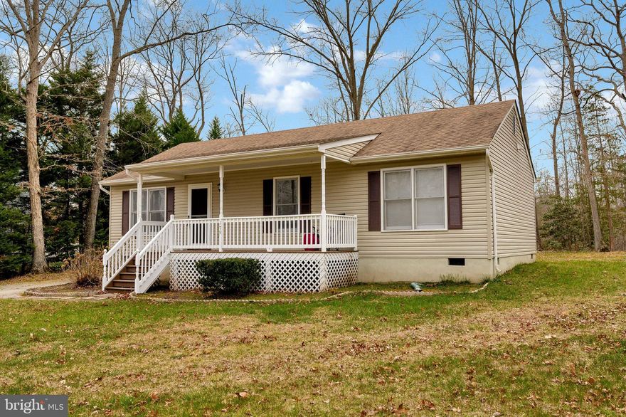 This is a must buy home , seller said he would pay the HOA Dues, lot transfer fee. Great location vaulted ceiling, granite countertops, beautiful laminate flooring in kitchen , large laundry room 3 bedroom  2 full bath, grab a cup of coffee and relax on the country front porch or your back deck this homes comes with a newer shed and a home warranty .