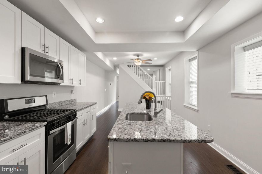 The One You've Been Waiting For has Finally Arrived! This meticulously renovated CHAP townhouse (2017) seamlessly blends timeless elegance with modern sophistication while offering OFF-STREET PARKING. Save THOUSANDS each year AUTOMATICALLY through the CHAP Certification. Just a few blocks from Patterson Park and nearby nightlife, this exquisite residence boasts 1,874 sq. ft. of beautifully finished space, featuring three spacious bedrooms and three and a half elegantly remodeled bathrooms. Inside you'll find the perfect blend of hardwood, tile and brand new carpeted flooring. The already brightly-lit home is further accentuated by recessed lighting, creating an inviting ambiance throughout. The gourmet kitchen is a chef's dream, equipped with high-end stainless steel appliances, upgraded countertops, and an expansive island perfect for entertaining. Retreat to the primary suite, a sanctuary of tranquility, complete with a luxurious en-suite bath and private deck space. The fully finished basement with walkout stairs offers additional living space, ideal for a home office or entertainment area. Outside, the sought-after private driveway ensures convenient parking all year round. A new roof (2022, with 15 year warranty), BRAND NEW HVAC (2026), and exterior doors (2017/2021) ensure you'll have peace of mind for years to come! Don't miss the opportunity to own this exceptional property combining luxury, comfort, and convenience. Your dream home awaits!