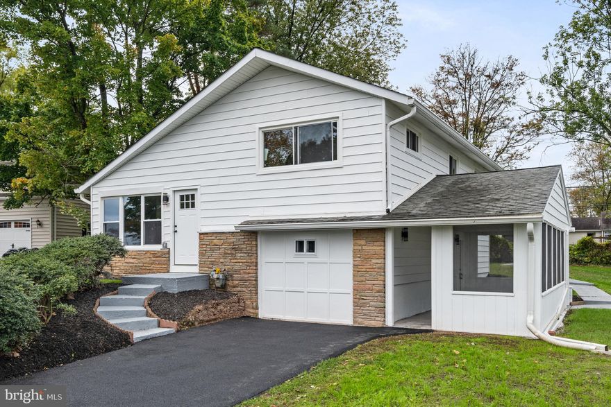 If you’ve been searching for a home that truly checks every box—quiet location, modern finishes, and generous space both inside and out—look no further. Welcome to this beautifully remodeled 3-bedroom, 2-bathroom home, perfectly nestled on a peaceful street in a peaceful neighborhood. From the moment you arrive, the expansive front yard captures your attention, while the sprawling backyard framed by mature trees creates the ideal backdrop for outdoor gatherings, gardening, or simply enjoying your own private sanctuary. With ample street parking and a private asphalt driveway, convenience is always at your doorstep. A few minutes away from restaurants, stores, parks and schools.Step inside and you’ll immediately notice the fresh, modern upgrades throughout—brand-new windows, doors, and so much more—nearly everything has been thoughtfully redone for your comfort and peace of mind. The sun-filled living room welcomes you with its large picture windows, filling the space with warmth and natural light. Just beyond, the stylish L-shaped kitchen awaits—featuring stainless steel appliances, gleaming snow-white cabinetry, and elegant quartz countertops. Upstairs, retreat to the serene main bedroom, accompanied by two additional versatile bedrooms and a beautifully updated hallway bathroom, all designed with comfort and relaxation in mind. The home continues to impress on the lower level, where you’ll find a full bathroom, convenient laundry/utility area, and additional living space created from the smart garage conversion. This level also offers crawl space access for extra storage. Step into the covered sunroom/porch—a charming all-season retreat perfect for sipping morning coffee, enjoying a good book, or unwinding at the end of the day. Throughout the home, luxury vinyl plank flooring ties the modern design together with durability and elegance. Homes like this are rare to find—beautifully updated, thoughtfully designed, and move-in ready. Discover the lifestyle you’ve been dreaming of and schedule your showing today before it’s gone!