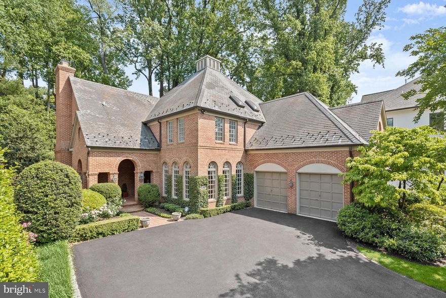 Fantastic New Price!  Welcome to 3117 Arizona Ave NW, a stunning brick home in the desirable Kent neighborhood, nestled above and away from the street, with a design that ensures peace and quiet. The property boasts five spacious bedrooms, along with four full bathrooms and two half bathrooms, spread across three meticulously finished levels. The first floor features a grand two story foyer, formal living room, dining room with  butler’s pantry, renovated kitchen, family room, den, powder room, mudroom with laundry and a two-car garage.  On the second level, you will find four bedrooms and three full bathrooms, each thoughtfully designed. Among them is the generous primary suite, complete with a fireplace, two walk-in closets, and a luxurious spa-like bathroom. One of the bedrooms has been transformed into an exquisite office, adorned with mahogany paneling. The lower level of the home offers a very large recreation room with a fireplace and half bathroom as well as a bedroom suite with a full bathroom.  Ample storage is available, catering to all your organizational needs. Step outside and enjoy a beautiful brick patio, perfect space for outdoor lounging, dining, and entertaining. A large motor court and two car garage complete the property. With its luxurious features and thoughtful upgrades, this property is truly a dream home.