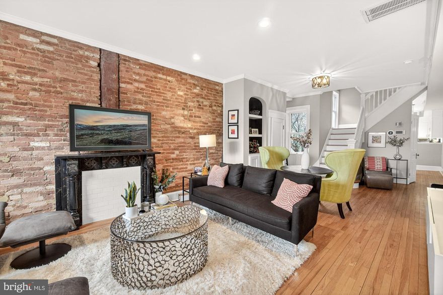 Stunning Downtown Gem with Historic Charm and Modern Updates

Welcome to this gorgeous home in the heart of downtown, where historic character meets thoughtful modern upgrades. Step through the vestibule into a spacious living room featuring exposed brick, soaring ceilings, and ample room to host gatherings or relax in style.

The beautifully updated kitchen was fully renovated in 2017 and enhanced in recent years with additional upgrades, including new kitchen flooring, expanded pantry cabinetry, under cabinet lighting, and GE Café appliances—refrigerator and dishwasher less than one year old. It’s a space designed for both everyday living and effortless entertaining.

Upstairs, the second floor offers a generous primary suite complete with a renovated full bath and walk-in closet. A charming bay window overlooks Second Street—perfect for enjoying the energy of downtown, including views of the beloved In the Streets festivities. This level also includes a second bedroom, an additional full bath, and an adorable balcony ideal for morning coffee or quiet reading.

The third floor features two more spacious bedrooms, offering flexibility for guests, home office space, or hobbies.

Outside, enjoy a low-maintenance backyard with an expansive paver patio—perfect for summer entertaining. Major updates include a new HVAC system (2019) and the addition of gas heat to the first floor and basement (2019), providing comfort and efficiency year-round.

This is downtown living at its finest—walkable, vibrant, and move-in ready.