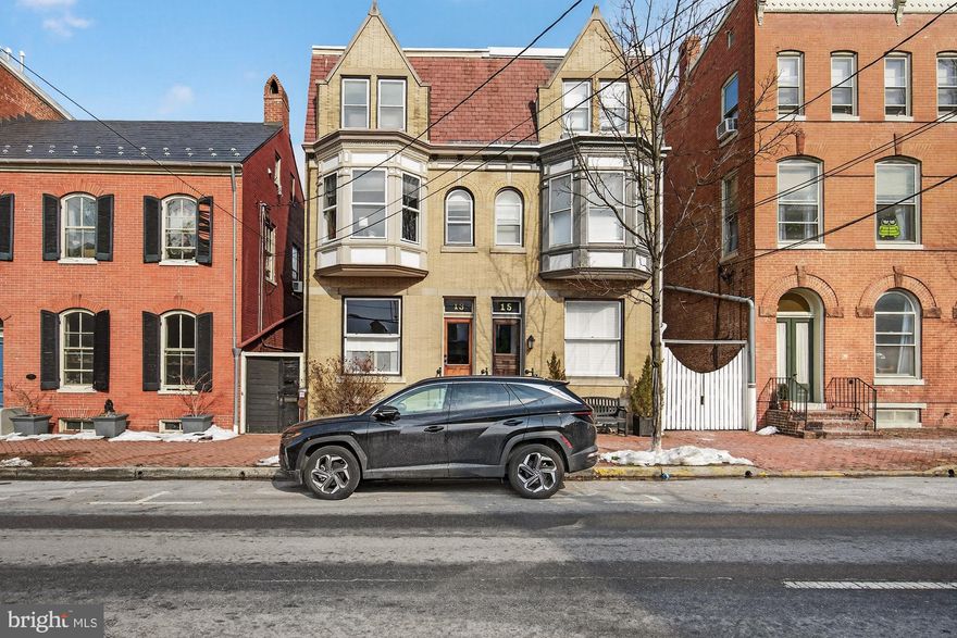 Stunning Downtown Gem with Historic Charm and Modern Updates

Welcome to this gorgeous home in the heart of downtown, where historic character meets thoughtful modern upgrades. Step through the vestibule into a spacious living room featuring exposed brick, soaring ceilings, and ample room to host gatherings or relax in style.

The beautifully updated kitchen was fully renovated in 2017 and enhanced in recent years with additional upgrades, including new kitchen flooring, expanded pantry cabinetry, under cabinet lighting, and GE Café appliances—refrigerator and dishwasher less than one year old. It’s a space designed for both everyday living and effortless entertaining.

Upstairs, the second floor offers a generous primary suite complete with a renovated full bath and walk-in closet. A charming bay window overlooks Second Street—perfect for enjoying the energy of downtown, including views of the beloved In the Streets festivities. This level also includes a second bedroom, an additional full bath, and an adorable balcony ideal for morning coffee or quiet reading.

The third floor features two more spacious bedrooms, offering flexibility for guests, home office space, or hobbies.

Outside, enjoy a low-maintenance backyard with an expansive paver patio—perfect for summer entertaining. Major updates include a new HVAC system (2019) and the addition of gas heat to the first floor and basement (2019), providing comfort and efficiency year-round.

This is downtown living at its finest—walkable, vibrant, and move-in ready.