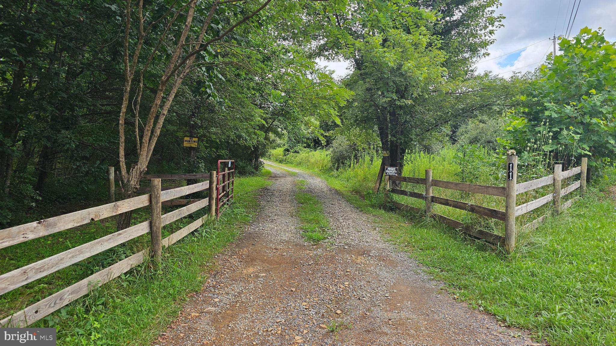 LOT 20 - 5 acre lot with cabin, well and septic. Cabin will not qualify for traditional financing. Building supplies on site to further the completion. This is the middle parcel of 3 adjoining lots. Can be sold separately or together. See separate listing for the 3 lots together. This lot enters from Wisteria Ridge and if sold separately will need to relocate driveway.
Information deemed reliable but not guaranteed.