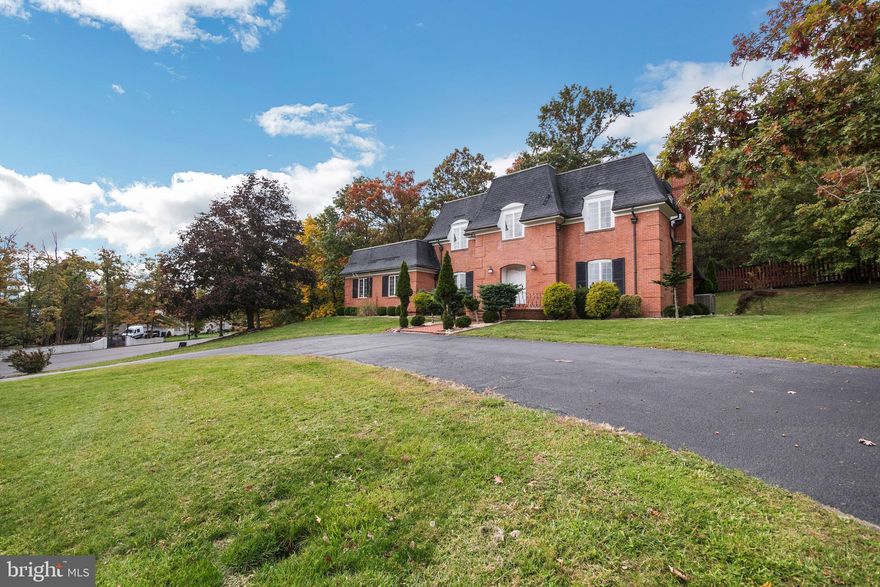 Architect Olin Rembold designed and built this stately brick home.  The home is situated on a corner lot and has a NEW ROOF.    Amenities include:  a first floor bedroom and bath, main level laundry room, breakfast room off of the kitchen, spiral staircase in the cathedral foyer, 4 fireplaces, deck off of the kitchen, and conveniently located to shops and major highways.  A new  heating system & duct work was installed after 2009 and is forced air with natural gas.  The sale also includes 2 additional parcels, Tax ID 0106044875, .2720 acres and Tax ID 0106047629, .2590 acres for a total of 1.034 acres of private luxury!