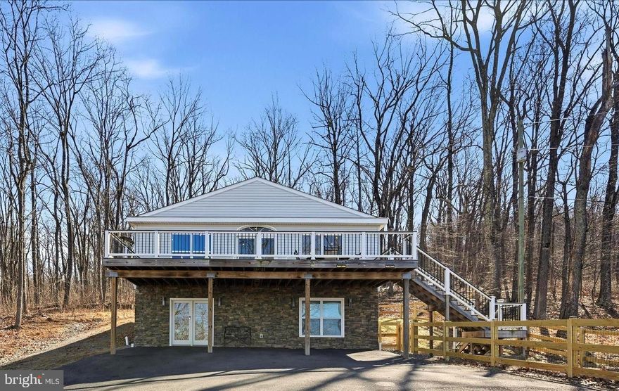 Enjoy stunning mountain views from this beautiful 3-bedroom, 3-bath home in the desirable Apple Mountain Lake community. Situated on just over 2 acres, this home features an open floor plan with a vaulted beamed ceiling and stone gas fireplace, creating a warm and inviting living space.
The gourmet kitchen offers custom cabinetry, granite countertops, stainless steel appliances, farmhouse sink, and a large island—perfect for entertaining. The spacious primary suite includes a walk-in closet with convenient pass-through access to the laundry room.
Step outside to an expansive deck and covered patio overlooking breathtaking mountain and valley views. The walk-out lower level includes a recreation room, third bedroom, full bath, and a bonus room ideal for a home office, gym, or guest space, plus generous storage.
Community amenities include a private lake, pavilion, playground, basketball and tennis courts. Convenient to Front Royal, Shenandoah National Park, Skyline Drive, the Shenandoah River, wineries, hiking, and dining, with a great commuter location to Northern Virginia.
A perfect blend of mountain views, modern comfort, and outdoor recreation. Enjoy the video tour and floor plan.