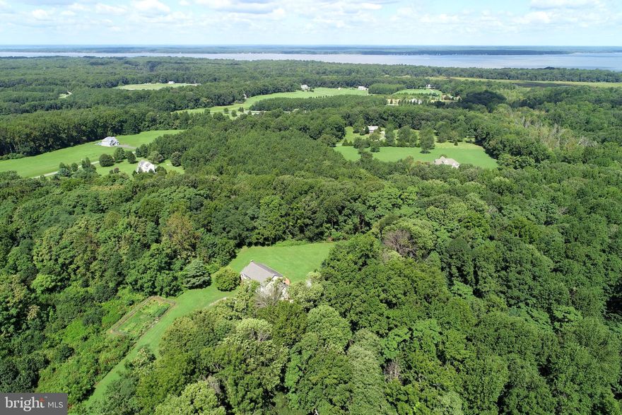 Beautiful building lot in an upscale community! All lots are 10+ acres. This lot offers 13+ acres of land with approx 3-4 wooded acres and is one of the more desirable lots in the community offering a beautiful sunset over rolling hills and backs the Panorama horse trail! The remainder is cleared and ready for you to build your dream home! Existing building on lot is a 2 car 2 level garage. Plenty of space for horses, ATV's, archery and more! HOA provides access to the community picnic area by the boat dock and  access to Chotank Creek. Approximately 3 miles to Dahlgren, 5 miles to 301 Bridge, and 8 miles to Rt 3.