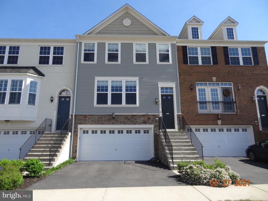 Multiple Offers were received. Welcome home to this spacious townhouse in the highly sought after Bradley Square Community of Manassas. Enjoy the Open Courtyard out Front of this Home. BBQ and Grill on your Deck off the Kitchen. Enter the Home to an Open Foyer. Beautiful Dark Wood Flooring on the Main Level Open Floor Plan. The Gourmet Kitchen has White Cabinets, Pendant Lighting,  Stainless Steel Appliances, and an Oversized Center Island, Perfect for Entertaining. Large Walk In Pantry. Separate Dining Room with Room for Large Table and 6-8 chairs. Spacious Family Room off the Kitchen. Half Bath on the Kitchen Level. Upper Level has Three Bedrooms, including the Primary Bedroom with a Deep Walk-In Closet, Full Bathroom, Double Sink Vanity and a Walk-In Shower. 2 more Bedrooms could also Perfect for an Office. Hall Bath on Bedroom Level. Laundry is on the Upper Bedroom Level. The Finished Basement has Recessed Lighting, Full Size Windows, Full Bathroom, and Room for a Family Room/Gym/Guest Room. 2 Car Garage with Extra Storage Space. Sliding Glass Door out to Backyard.  HOA and Neighborhood Amenities include a Splash Park,  Playgrounds, as well as Hiking and Nature Trails. Convenient to Lots of Shopping, Dining , Old Town Manassas to include Festivals and Parades. Easy access to I95,I66, and the Prince William Pkwy for Commuting. Plenty of Parking in the Community. Mailboxes are Right out the Front Door. Walk to the Elementary School. Short Bus Ride to Middle and High Schools. VRE is about 5 miles away.