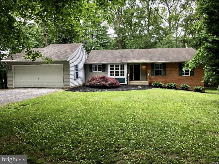 If you are looking for peace and quiet, for a lovely home set way back off of the road with plenty of yard for playing/gardening/relaxing but not too much yard to easily care for...that will give you plenty of parking PLUS space for your workshop/ additional cars/ utility vehicles/ hobbies/ tinkering - then this is it! This sweet raised rancher offers a spacious Kitchen & open Living/Dining Room w/ beautiful hardwood floors and fantastic natural light and the option for truly 1-level living.  The Lower Level provides an enormous amount of versatile finished space including a full bath, wet bar & walk-out stairs to the back yard - what will you create?  Game Room, Recreation Area,  Exercise/Yoga Room or In-Law/Au-Pere Quarters?  The options are endless. Retire at the end of the day to your woodland retreat - private and peaceful while being located perfectly in the middle of Westminster & Hereford and convenient to Hampstead shops, Prettyboy Reservoir, and Oakmont Green Golf Course.