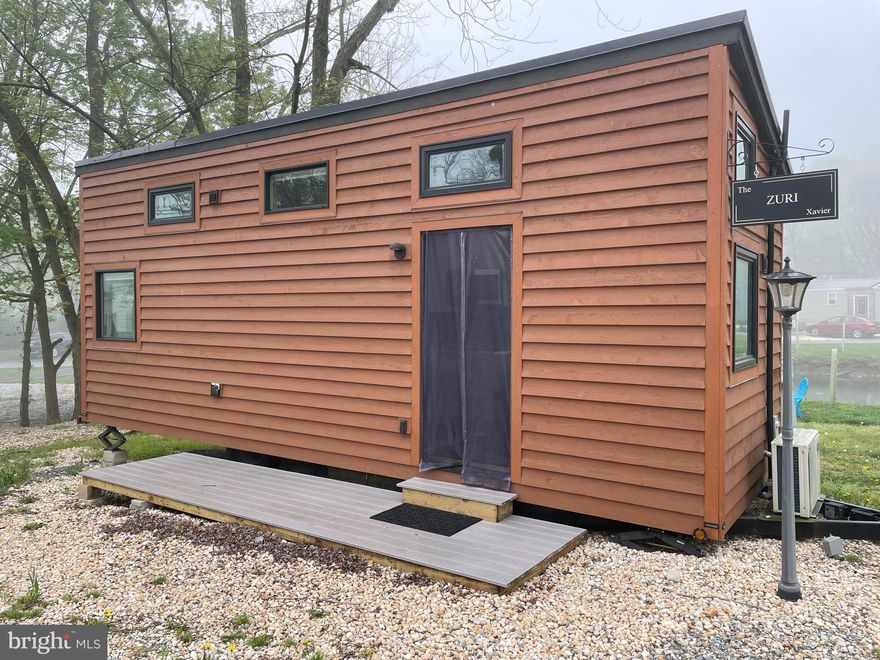 One bill. One view. A whole community. Welcome to your waterfront sanctuary at Tiny Estates! This modern tiny home features a pond in your backyard and a lifestyle of total convenience.

Say goodbye to juggling monthly statements—your fee is truly all-inclusive, covering your lot rent plus ALL utilities: electric, water, sewer, trash, and even high-speed Wi-Fi.

But you’re buying more than just a home at 867 Schwanger Rd; you’re joining a vibrant neighborhood. Whether you’re meeting friends at the community center, testing your green thumb in the community garden, or joining in on resident meetups, this is a place where neighbors actually know each other. It’s the ultimate E-town retreat for anyone looking to downsize their stress and upgrade their social life. Waterfront living has never been this simple!