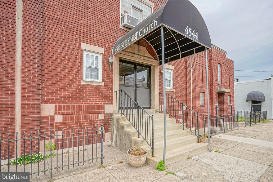 This is a Rare Opportunity to purchase a Massive and Spectacular building in the heart of the Beautiful Bridesburg Neighborhood. Situated on a quiet and gorgeous block on the 4500 Block of Almond Street which is a block of homes. This building is currently being used as a Church and has been for over 20 years. Public Records says it is over 9,000 Square feet. You walk into a lobby. On one side is a small office and on the other side is a receptionist area/office. A powder room. Then at the end of the lobby you will walk into White French Doors that lead you into the main Hall room. Call it an Auditorium ,Ballroom, or event space. This main Hall is magnificent. The ceiling is estimated to be around 18 Feet Tall. There is a stage that is currently not in use and is boarded up. Behind the stage area is a conference room. To the side is an office with a half bathroom. Then to other side of the building is a huge area of multiple conference rooms an d a room that was used as a nursery. There are 2 sets of stairs that go up from the main Hall. One side it leads to an open wood floored room and a full bath with stall shower. On the other staircase, that leads you to a bathroom that is not in use. Walk down to the lower level and you will find a very large banquet style room that can hold many tables and chairs. A kitchen space is set at the back of it. Also on this level you will find another couple of rooms. Some are storage and some are currently open space. Lots of space on this lower level. There are multiple bathrooms with stalls. There is a lower level office that has storage in it. There is outdoor space on both sides of the building which you can see in pictures. This building is unique and remarkable. Buyer is responsible for any and all due diligence, Buyer is responsible for the City Certification Statement and Use & Occupancy and Zoning. Buyer must also investigate the Real Estate Taxes and what they could potentially be. The Church was exempt from paying real estate taxes so an amount does not show. Bridesburg is an area where the people who live here take Pride in living here. This is a special opportunity to purchase a building like this in one of the Riverwards neighborhoods, especially this neighborhood.