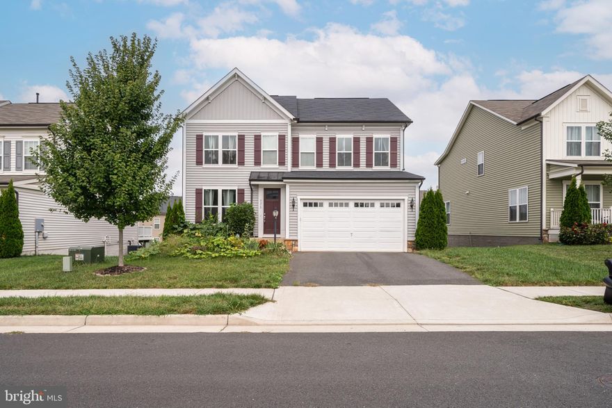 Home sweet home in Prince William County. You will fall in LOVE with this beautiful single-family home in Manassas. Four bedrooms, three and a half bathrooms, and almost 3,700  finished square feet of living space. As soon as you enter, you'll be struck by the bright and welcoming atmosphere created by the large windows and stunning dark hardwood floors. The open-concept design makes entertaining a breeze, with the modern gourmet kitchen at the heart of the home. The kitchen is equipped with granite countertops, stainless steel appliances, and a large pantry for all your cooking needs. Step outside of the walk-out basement to the open-level yard and relax on the patio, accessible through the oversized sliding doors of the large recreation room. Upstairs, you'll find the owner's suite, complete with two spacious walk-in closets and a luxurious ensuite bath. Three additional bedrooms (all with extensive closet space), another full bathroom, and a convenient laundry area complete the upstairs. The basement is perfect for additional living space, featuring a rec room and full bathroom. This gem is superbly located in Manassas. Close to shops, restaurants, major highways, and a DC commuter lot. Schedule a viewing today and fall in love with your new home! This home sits in Prince William County and is Zoned for Prince William County Schools.