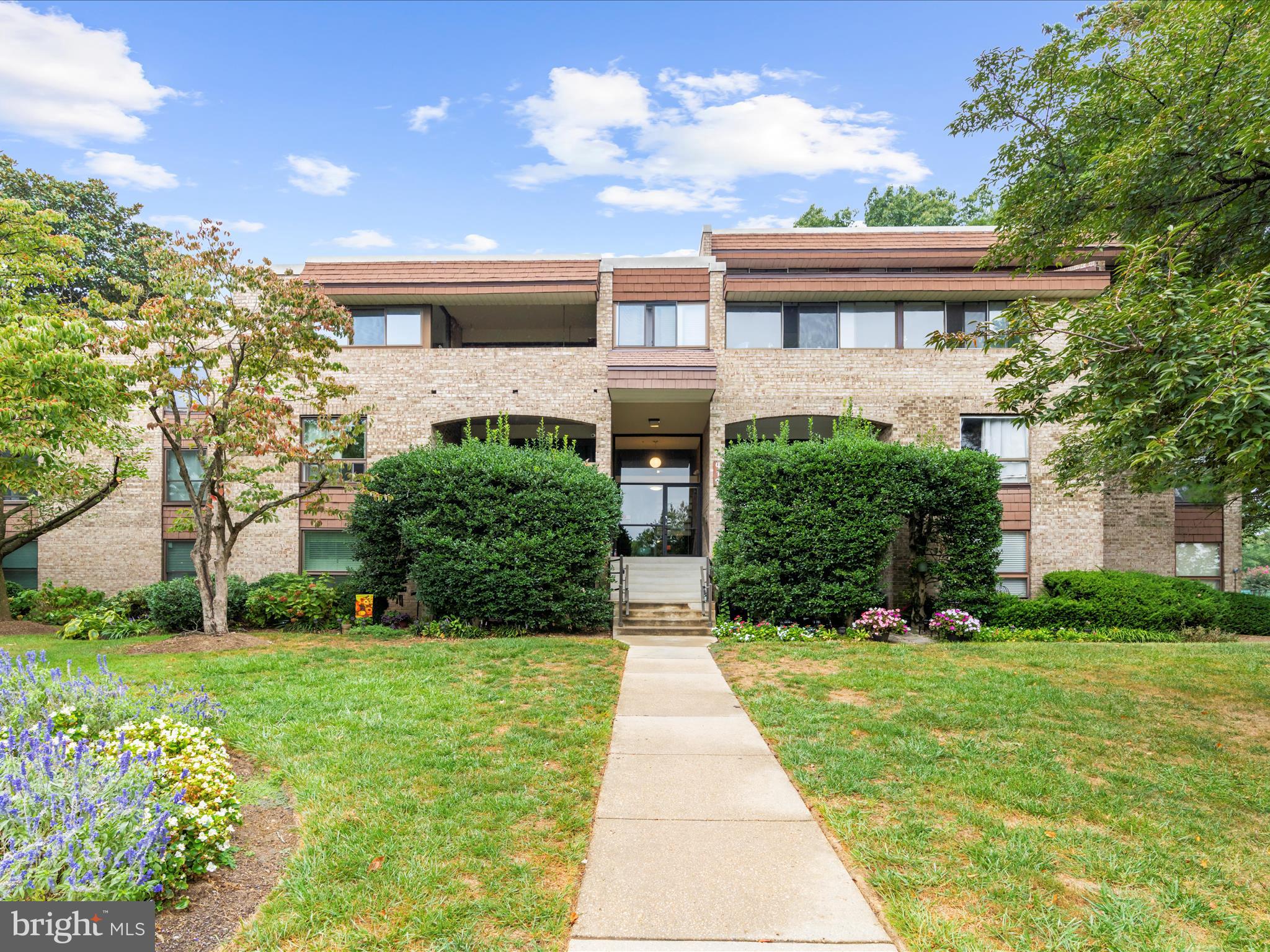 Beautifully updated first-floor condo offering 2 spacious bedrooms and 2 full bathrooms. Step into a freshly painted interior with brand-new carpeting throughout. The bright living room features a sliding glass door that opens to a walk-out patio, providing direct access to the rear sidewalk, additional parking lots, and the community pool area. The eat-in kitchen is a standout with granite countertops, stainless steel appliances, wood cabinetry with stylish hardware, ceramic tile flooring, and modern lighting. The primary bedroom includes a walk-in closet, and a private en-suite bathroom. Both bathrooms have been updated with new fixtures and shower surrounds. Stacked washer & dryer in-unit (2022). Additional features include secured main entry and a personal storage bin located within the building. Residents enjoy a range of community amenities, including a swimming pool, tennis court, and picnic areas with grills and much, much more. HVAC system replaced in 2024. Move-in ready and perfectly located near restaurants and shops for comfort and convenience! Come tour this unit today!