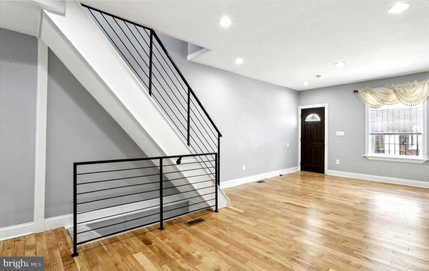 Welcome to 2505 S Sheridan St! This newly renovated South Philadelphia row home offers 2 bedrooms and 1 bathroom and is move-in ready. The open-concept living and dining area features recessed lighting and hardwood floors throughout. The modern kitchen includes white shaker cabinets, quartz countertops, subway tile, and stainless steel appliances, and opens to a private backyard perfect for entertaining. Upstairs are two well-sized bedrooms and an oversized, updated full bathroom. The fully finished basement provides additional living space along with a washer and dryer. Conveniently located near shopping, public transportation, I-95, and major bridges—this is one you won’t want to miss!