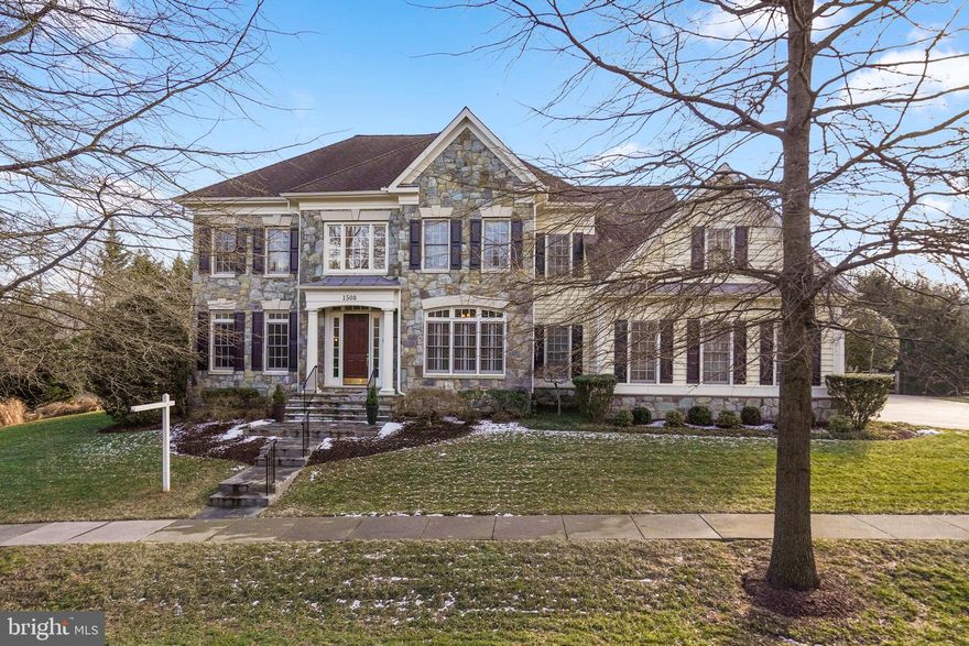 Rare opportunity to own a showstopping home on a picturesque and uniquely private lot in the Bancroft neighborhood! Built by Mitchell & Best homes, this sensational stone-front Westport II model with 6BR/4.5BA and three-car garage exudes quality craftsmanship! The floor plan boasts over 7,000 square feet of living area on three levels including over 5,000 square feet above grade.  Designer-home appeal including lots of natural light, high ceilings throughout, multiple tray ceilings, gleaming hardwood flooring throughout the main level, elaborate multi-piece moldings, and recessed lighting throughout the home. Grand two-story foyer; formal living room and dining room; double glass door entry to main level study/home office; great room with tray ceiling, wall of windows, ceiling fan, and flagstone gas fireplace with stone hearth; gourmet chef’s kitchen with center island , breakfast bar, granite countertops with ceramic tile backsplash, wood cabinets (some with glass doors), stainless steel appliances (refrigerator new 2021; built-in microwave & dishwasher new 2017), wine rack, and wine refrigerator; breakfast room off of kitchen leading to glorious covered porch which leads to the open deck w/hot tub and steps to backyard; mudroom off of the kitchen with washer/dryer (replaced 2019) and access to three-car garage; hardwood staircase to upper level as well as a second rear staircase from kitchen. Upper-level features owner’s suite with hardwood floors, tray ceiling, gas fireplace, step-down sitting room/office with recessed lighting and built-in cabinetry, one wall closet and 2 walk-in closets; luxurious spa-like owner’s bath with two separate vanities, ceramic tile shower with bench seat and glass enclosure, soaking tub with tile tub deck, and separate water closet; plus, four additional bedrooms on the upper level and two buddy baths. Fully finished lower level with carpeting and recessed lighting throughout; recreation room featuring a full-size bar with full-size French door refrigerator and sink; sixth bedroom and ceramic tile full bath; finished exercise room and sauna; walkout stairs to amazing and private backyard. Zoned HVAC system – 2 furnaces and 2 A/C units replaced in 2019. Hot water tank replaced 2020. Replaced all exterior trim in 2015 and repainted in 2019. Perimeter fence in the backyard replaced 2016. Bancroft is a private, distinguished neighborhood that has the feel of a gated community with sidewalks and a central neighborhood park with tot-lot. It is in Sandy Spring which is nestled just West of the retail and restaurants of Olney Village as well as healthcare services from MedStar Montgomery Medical Center.