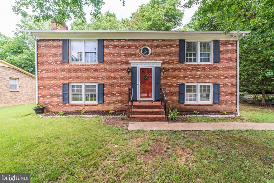 Welcome Home! This spacious four-bedroom, two bathroom split-level home sits on over 1/3 acre with a beautiful deck and backyard oasis. The modern design paired with a bright and airy interior with plenty of natural light make this home a must see. Start your morning sipping coffee on the back deck overlooking the trees. Inside, the upper floor features a large open living room, and dining area with a kitchen and breakfast bar and has gleaming hardwood floors throughout. You will love the updated countertops, brand new stainless steel appliances and sink, and the ample kitchen storage space.  The two bedrooms upstairs have great closet space and can easily accommodate a king-sized bed. Both bathrooms have updated floors and the upstairs bathroom vanity top will be replaced in the beginning week of July. The bottom level of this split floor plan features an exposed brick, wood-burning fireplace with custom built in shelving, laundry closet, additional entertainment room, two bedrooms, and a full bath with an egress door out to the back yard. The two additional bedrooms both have standard sized closets and water resistant flooring throughout. The laundry is a full sized washer/dryer. This home has a large driveway for parking accommodations, plus a large storage shed in the backyard. Enjoy the natural oasis that surrounds you and convenient location right off of Route 1, and minutes from shopping, Starbucks, restaurants, and Amtrak and Greyhound Stations.Sellers spared no expense on this home: Repainted, all new kitchen appliances, sink and light fixtures, new flooring in both bathrooms, repainted deck, new storm door, new vanity top in upper bathroom (coming soon), new front door (coming soon).